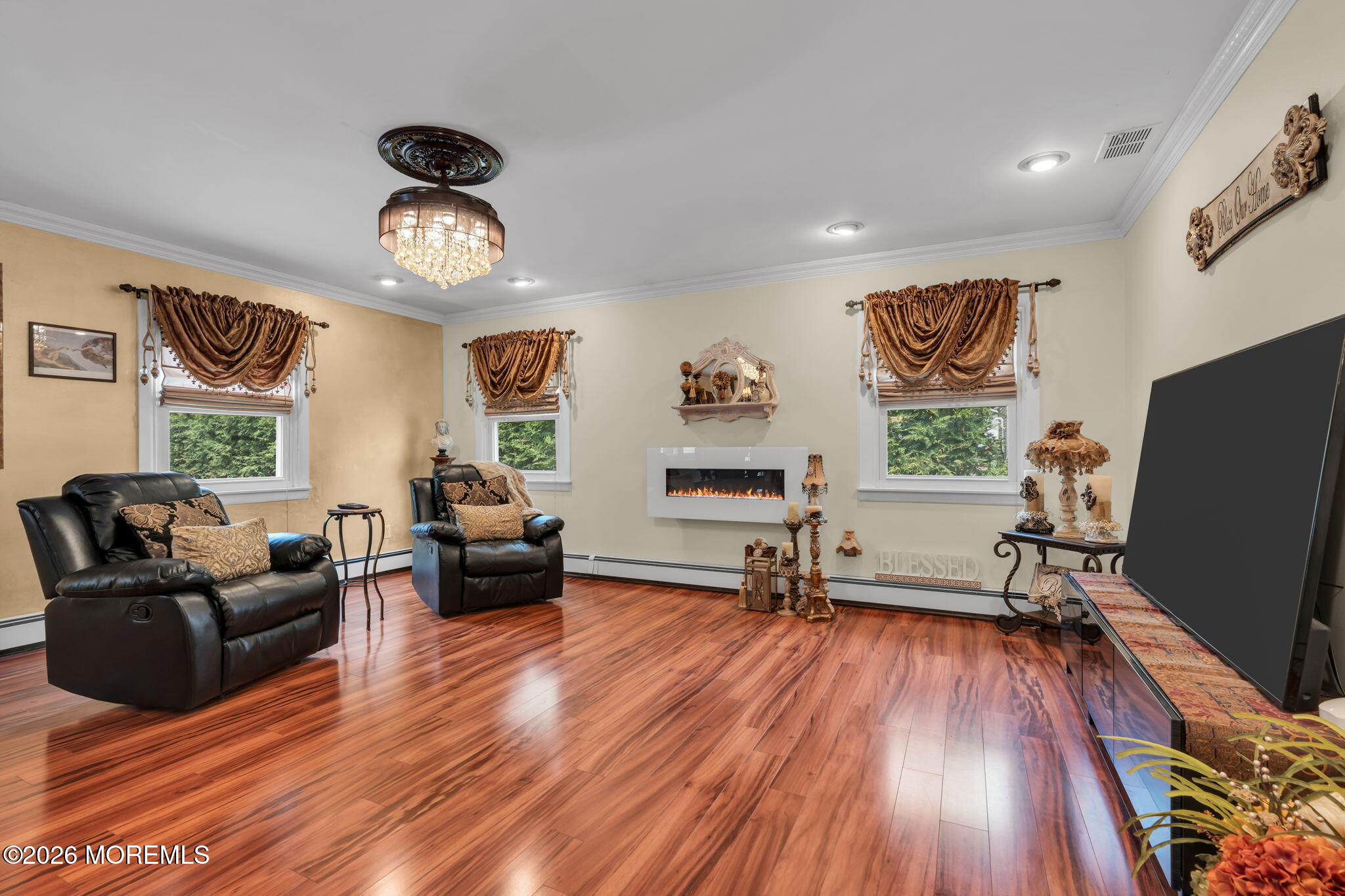 8 Owens Road Marlboro, NJ 07746 - Photo 21 of 39 a living room with furniture and a wooden floor