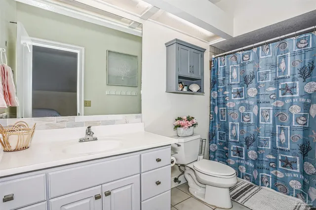 a bathroom with a sink double vanity and a mirror