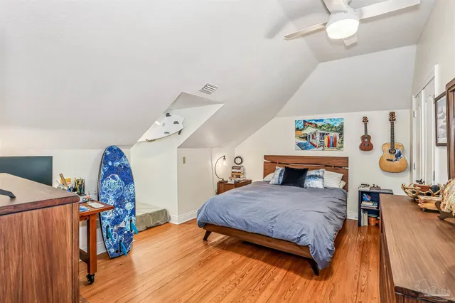 a view of a roof deck with wooden floor and a table