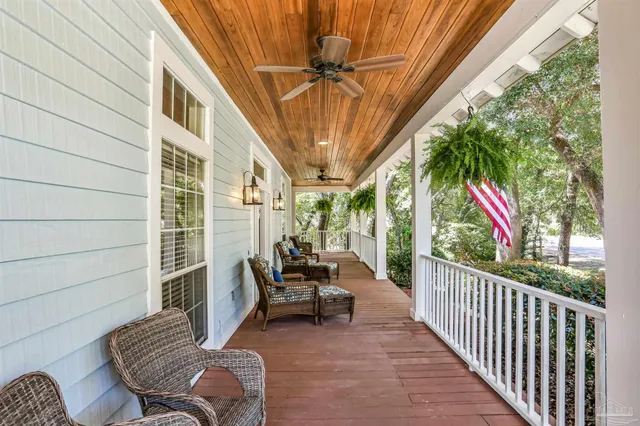 a view of two chairs in the balcony