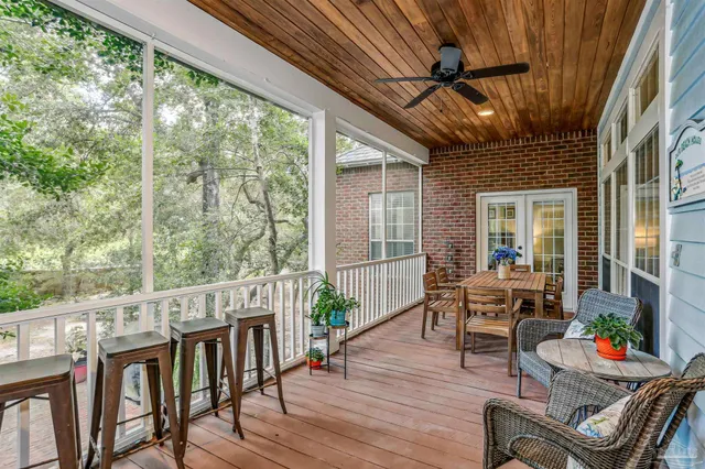 a sign that is sitting on a brick wall