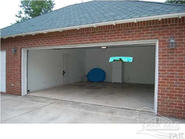 a view of an entryway with wooden floor and windows