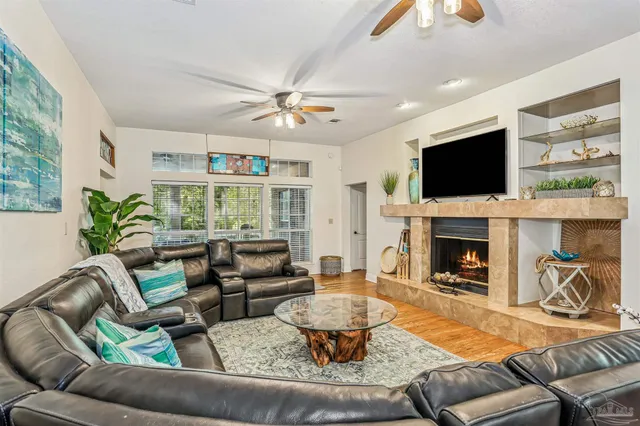 a living room with furniture and a flat screen tv