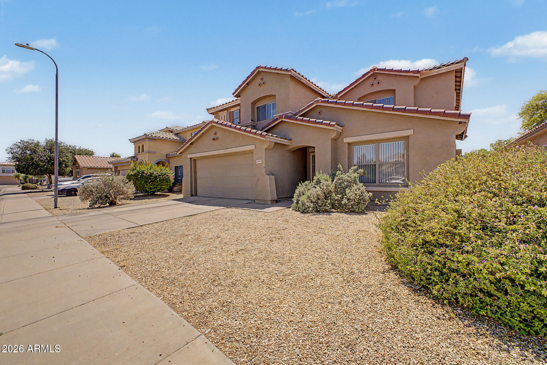 2607 West Bloch Road Phoenix, AZ 85041 - Photo 3 of 34 a front view of a house with a yard