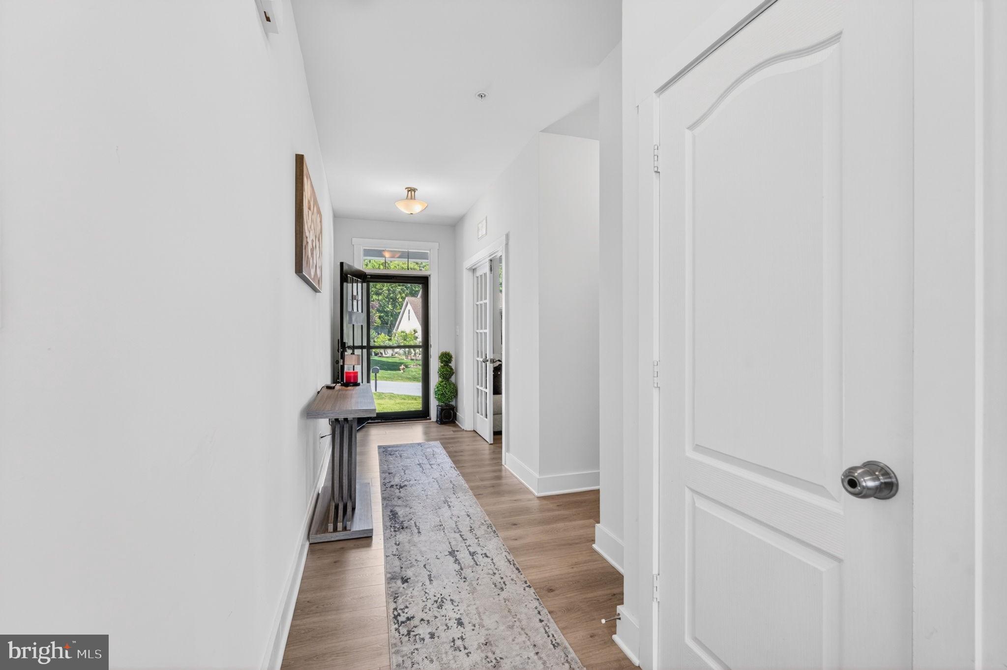 30 Range Road North East, MD 21901 - Photo 58 of 73 a hallway with wooden floor table and chair