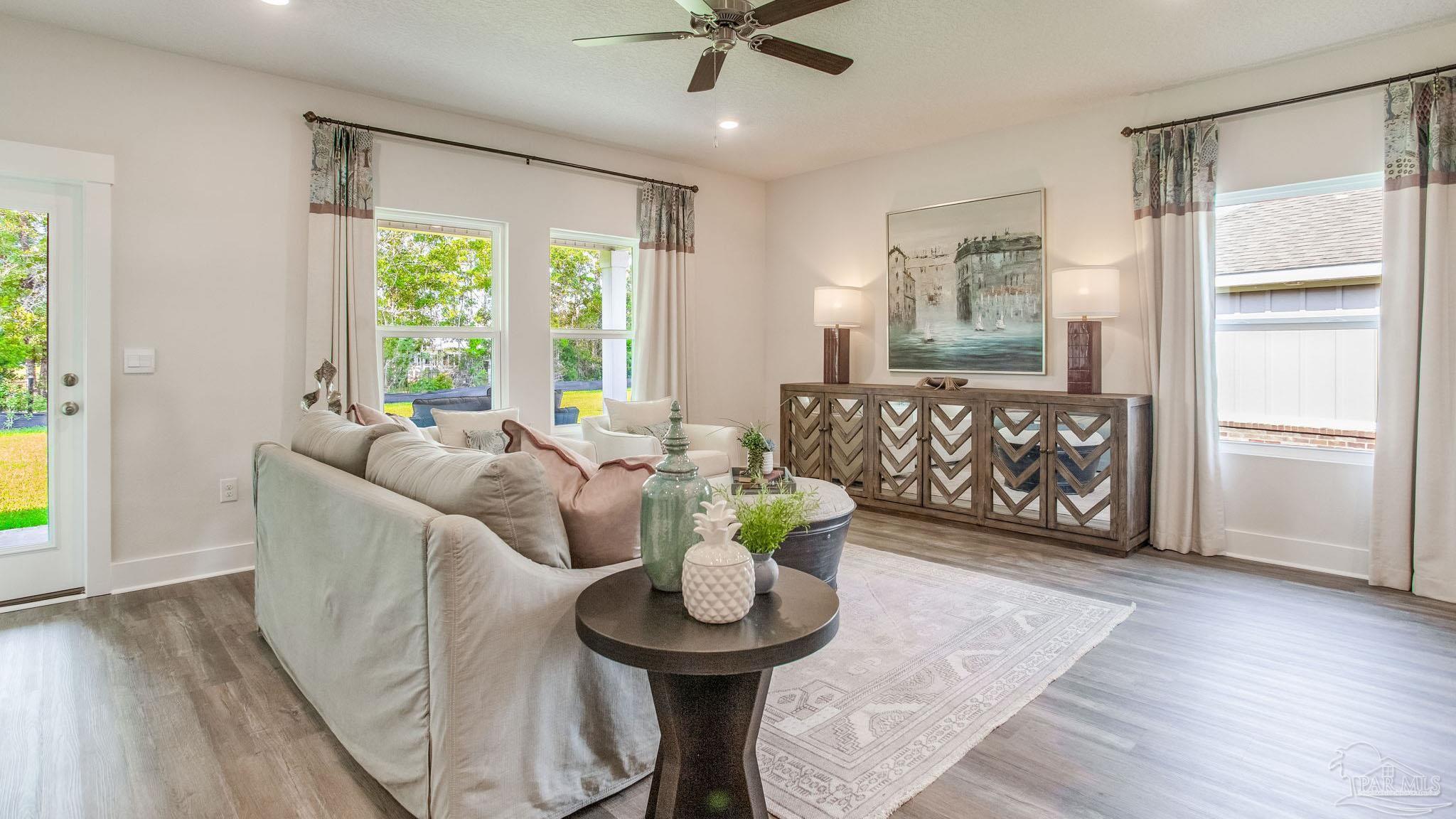 4631 Eider Road Pace, FL 32571 - Photo 15 of 46 a living room with furniture and a large window