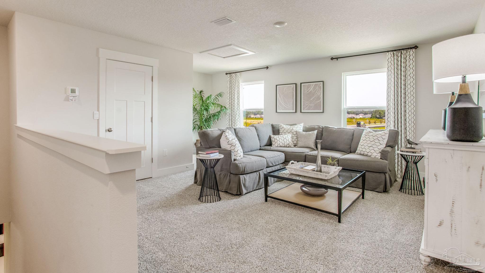 4631 Eider Road Pace, FL 32571 - Photo 16 of 46 a living room with furniture and a window