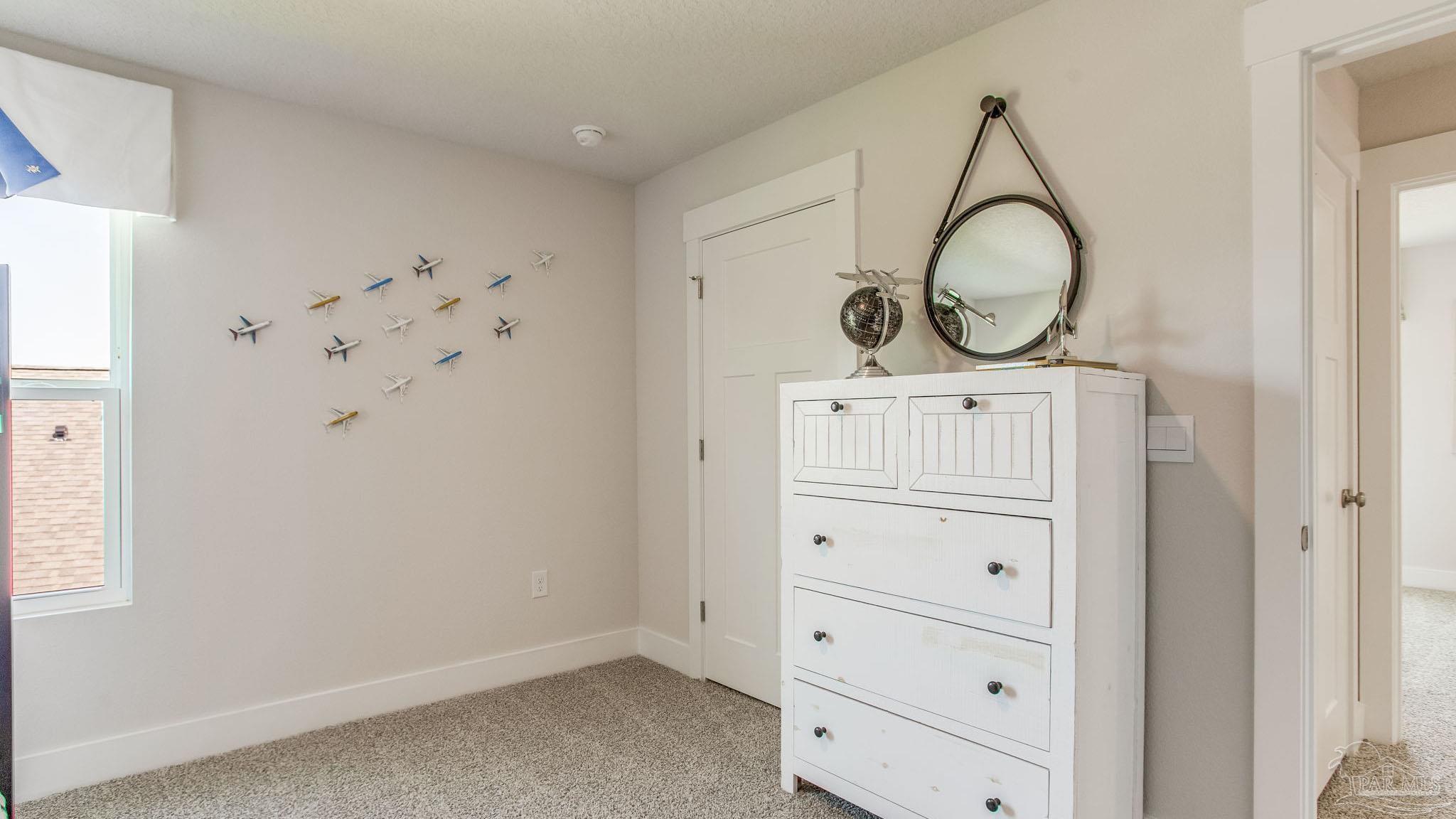 4631 Eider Road Pace, FL 32571 - Photo 19 of 46 a view of a closet and storage