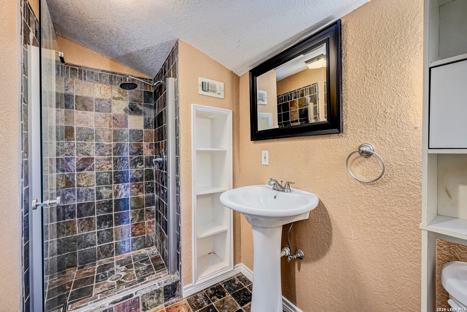 1125 Highpoint Lane Spring Branch, TX 78070 - Photo 14 of 25 a bathroom with a sink mirror and toilet