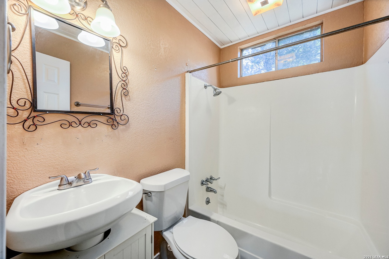1125 Highpoint Lane Spring Branch, TX 78070 - Photo 18 of 25 a bathroom with a sink toilet and shower