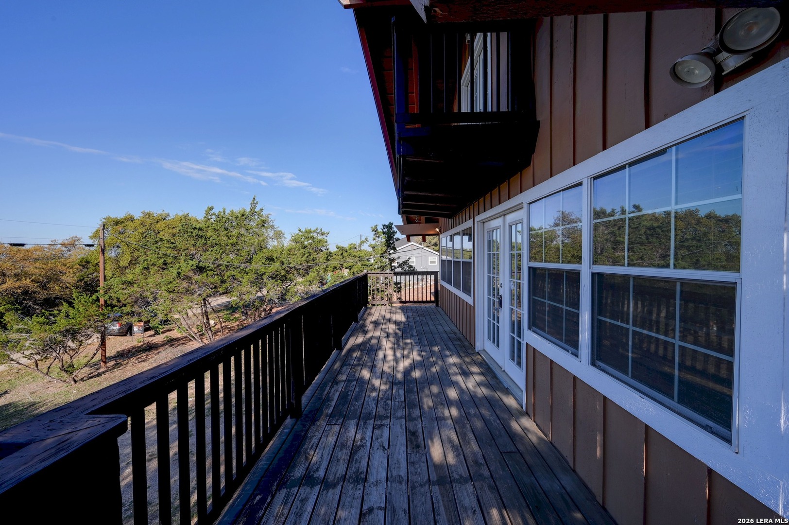 1125 Highpoint Lane Spring Branch, TX 78070 - Photo 20 of 25 a view of a balcony with wooden floor