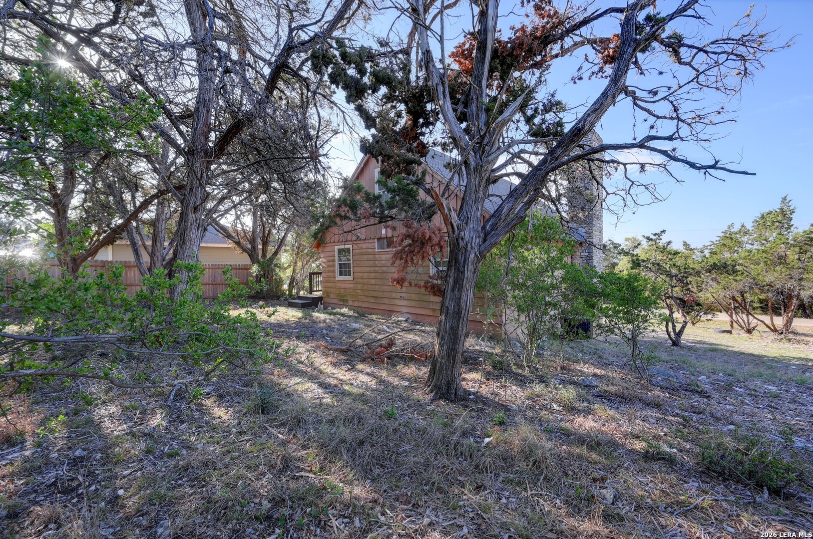 1125 Highpoint Lane Spring Branch, TX 78070 - Photo 24 of 25 a view of a yard with lots of trees