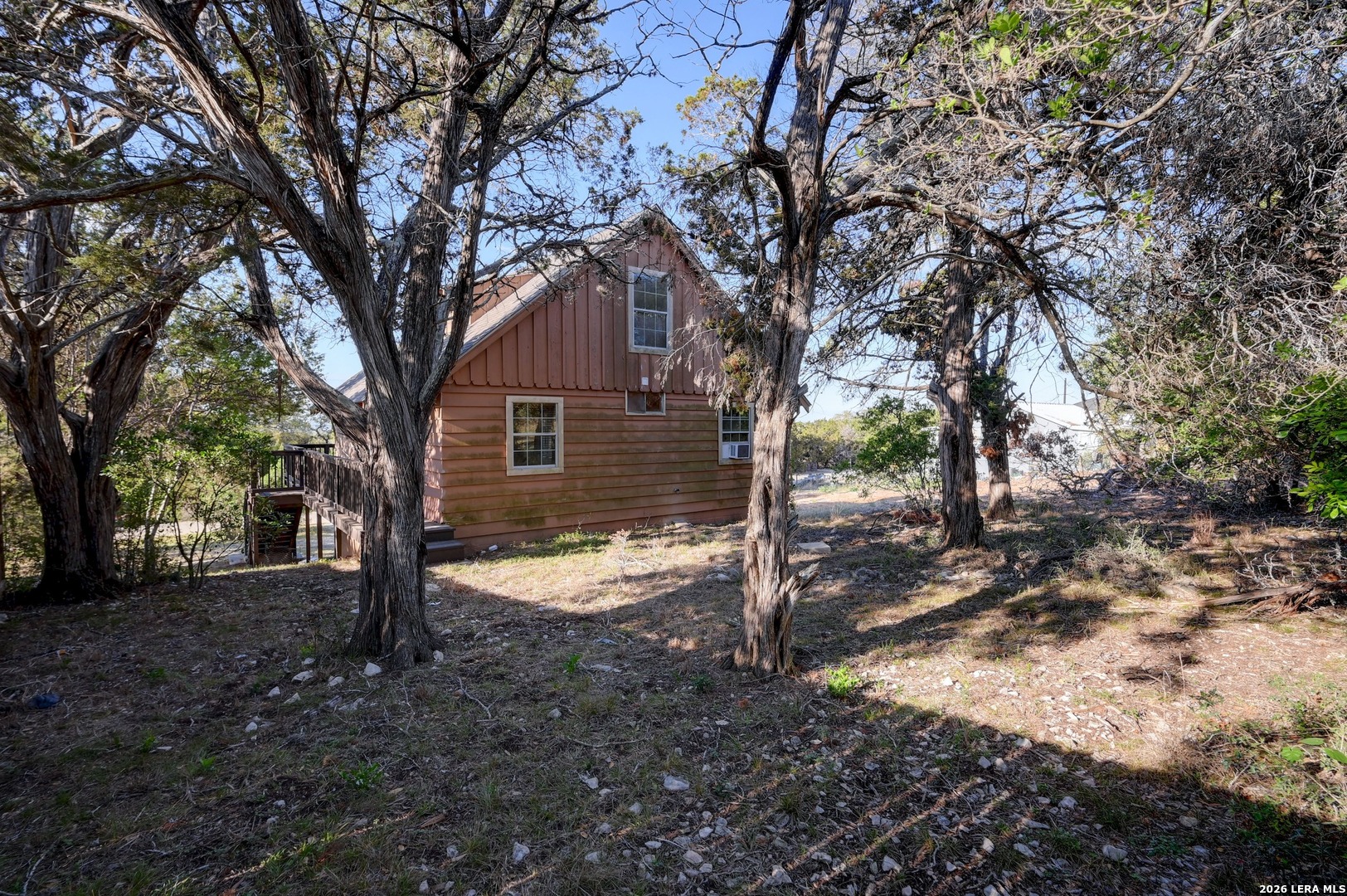 1125 Highpoint Lane Spring Branch, TX 78070 - Photo 25 of 25 a view of a yard with a tree