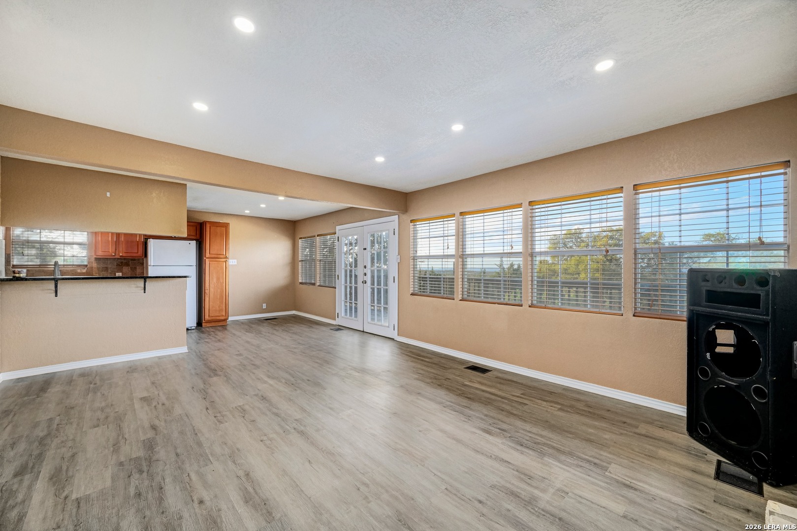 1125 Highpoint Lane Spring Branch, TX 78070 - Photo 7 of 25 a view of empty room with wooden floor and fireplace