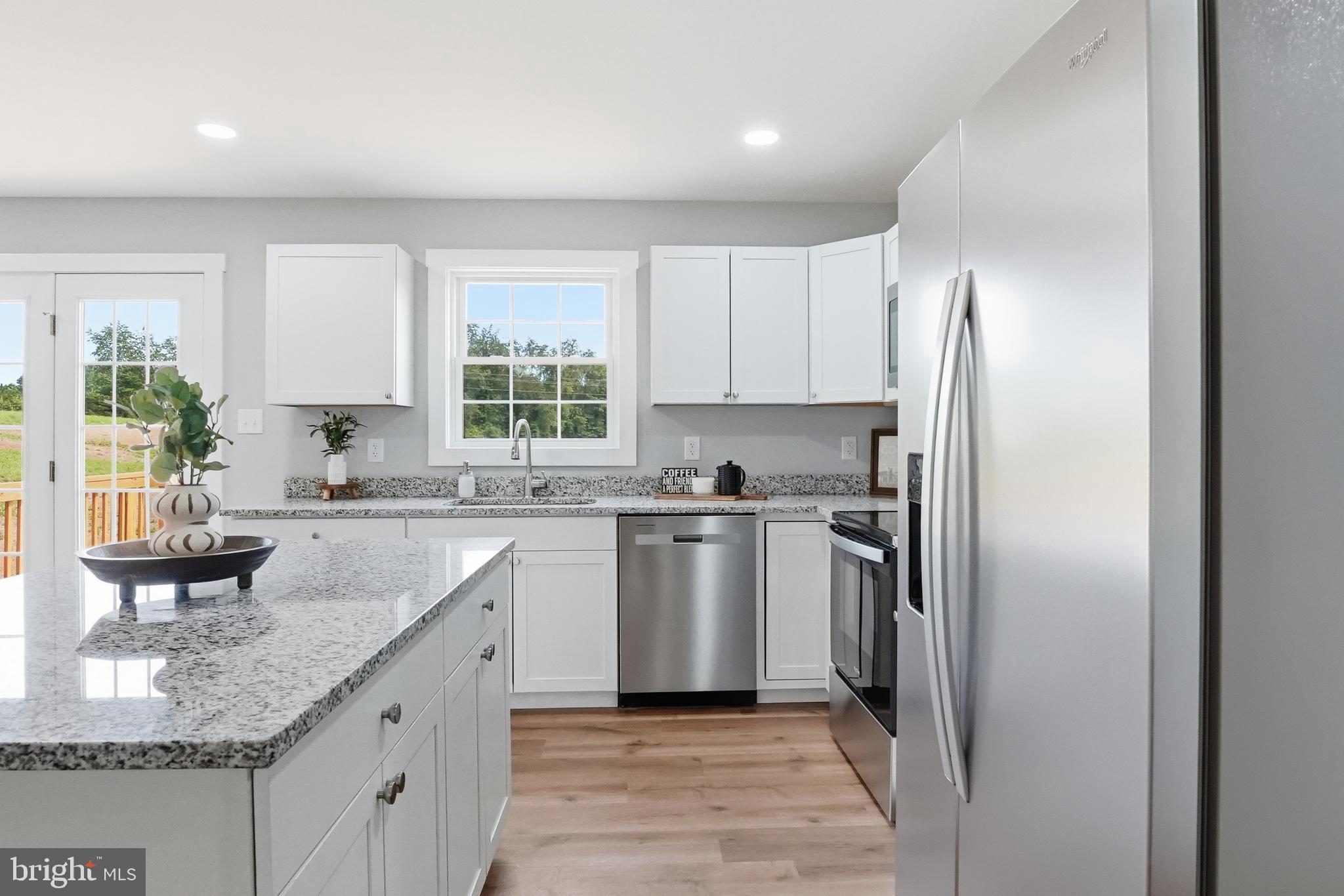 2974 Novum Road Reva, VA 22735 - Photo 20 of 44 a kitchen with stainless steel appliances granite countertop a refrigerator sink and stove