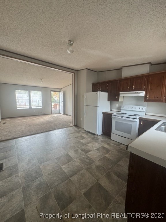 142 Oak Street Fayetteville, NC 28306 - Photo 1 of 6 a open kitchen with cabinets and a stove top oven