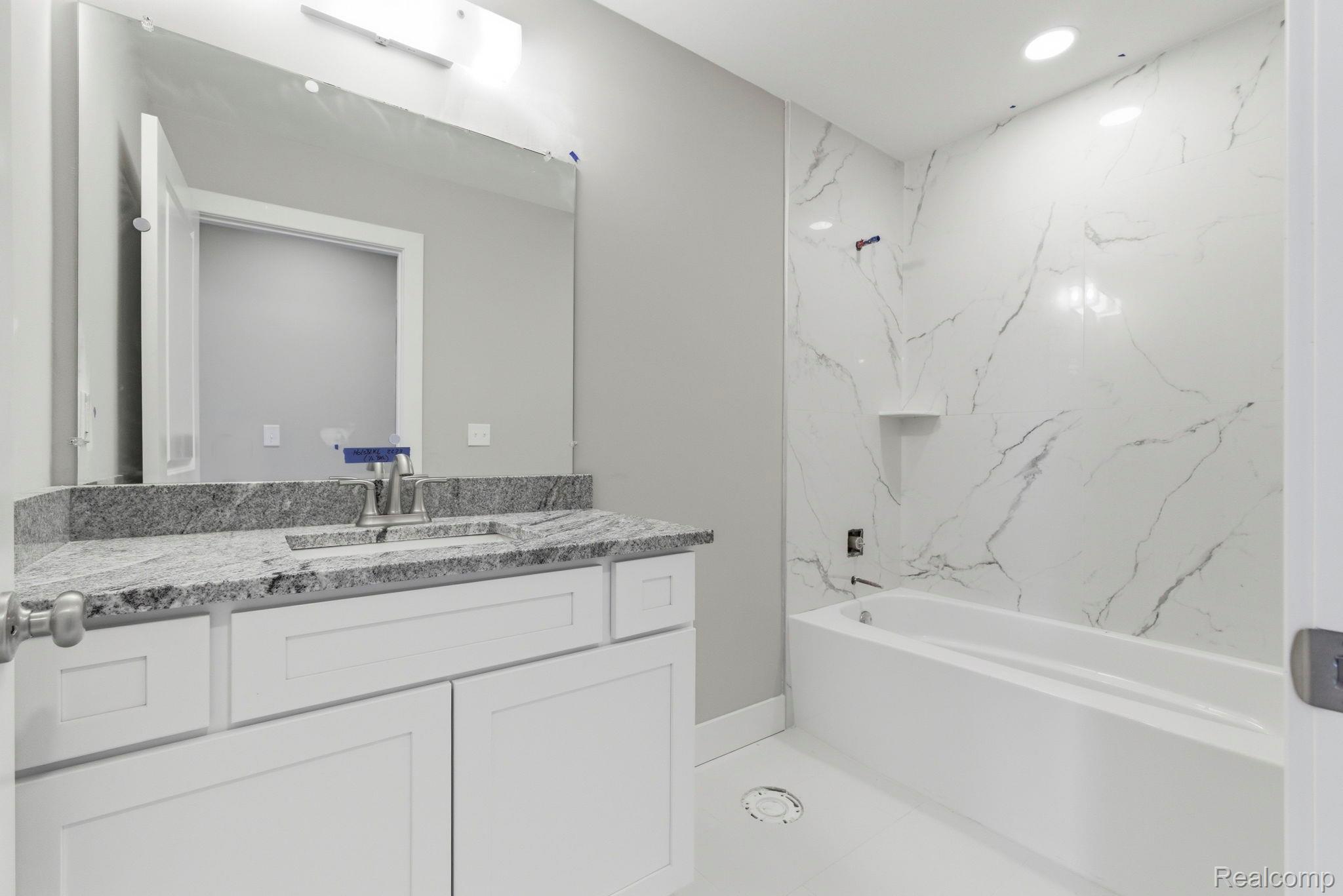 2281 Baltimore Davison, MI 48423 - Photo 18 of 26 Full bathroom with vanity, bathing tub / shower combination, and recessed lighting