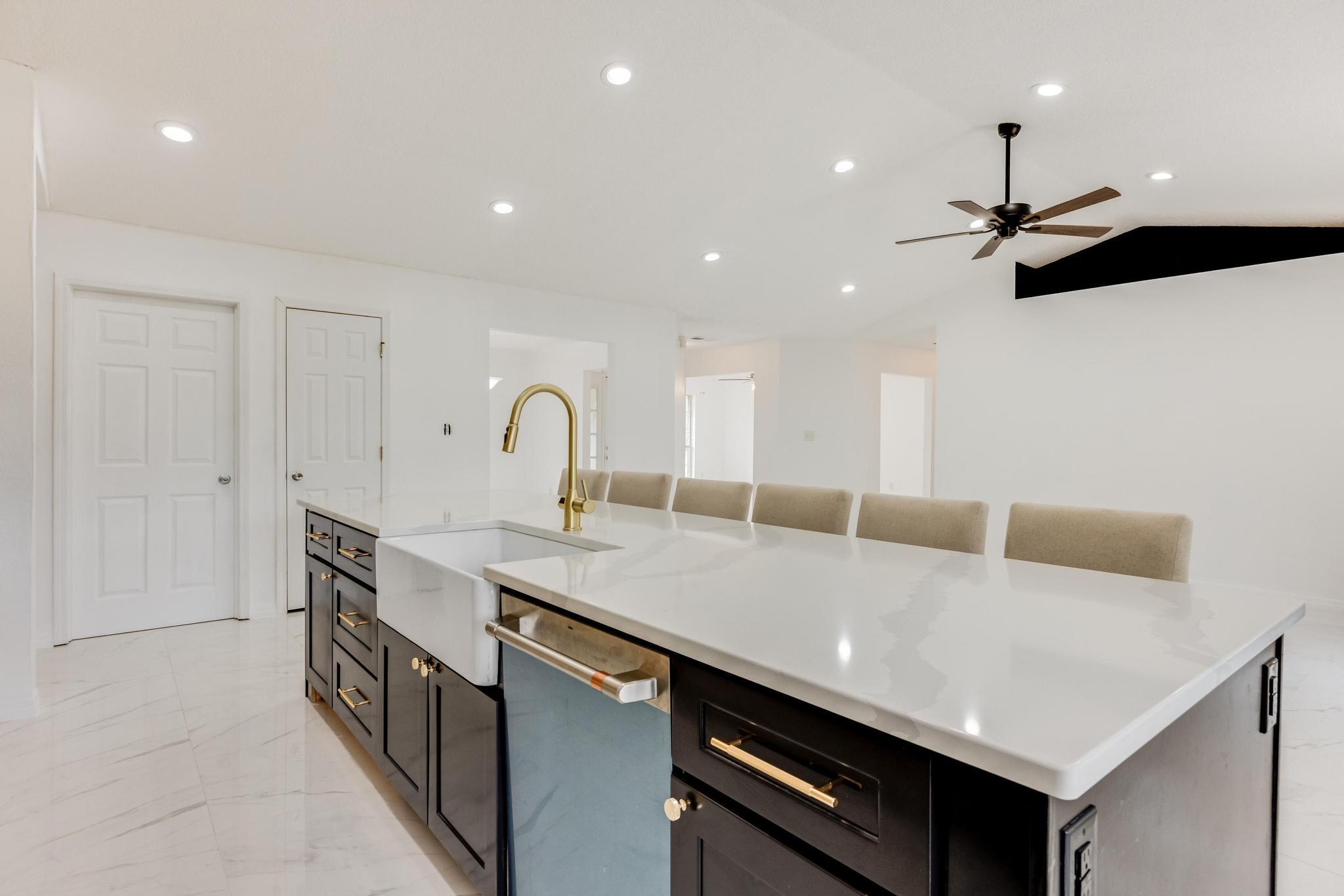 4140 Big Buck Trail Crestview, FL 32539 - Photo 15 of 40 a open kitchen with stainless steel appliances granite countertop a sink a oven and a refrigerator