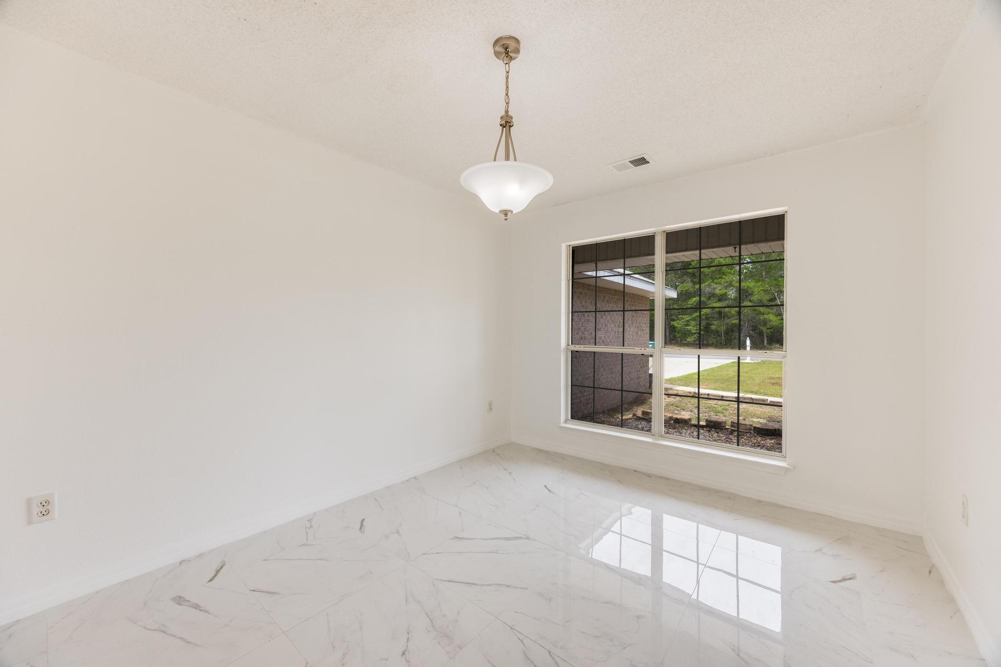 4140 Big Buck Trail Crestview, FL 32539 - Photo 17 of 40 a view of an empty room with a window
