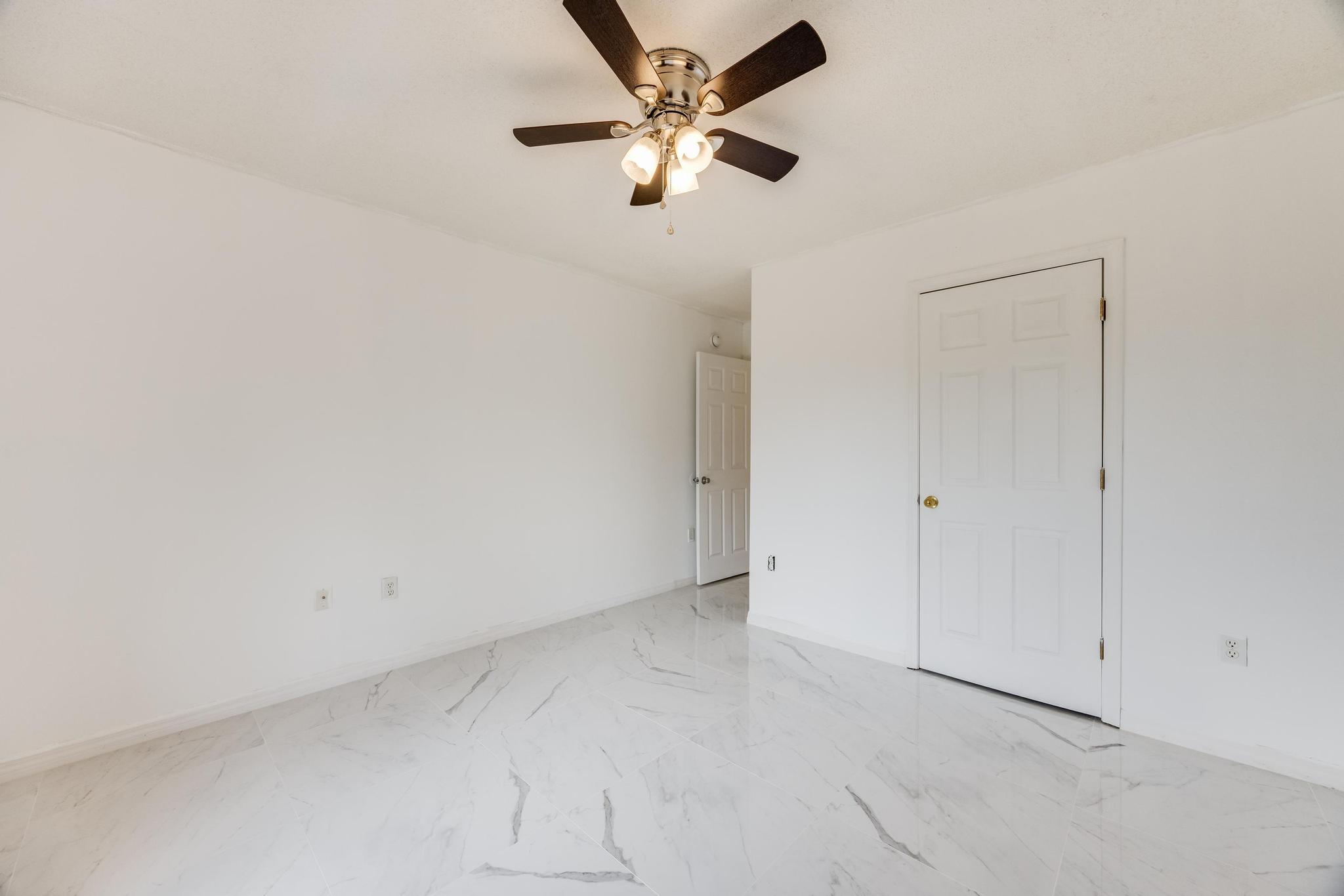 4140 Big Buck Trail Crestview, FL 32539 - Photo 29 of 40 an empty room with closet and a chandelier fan
