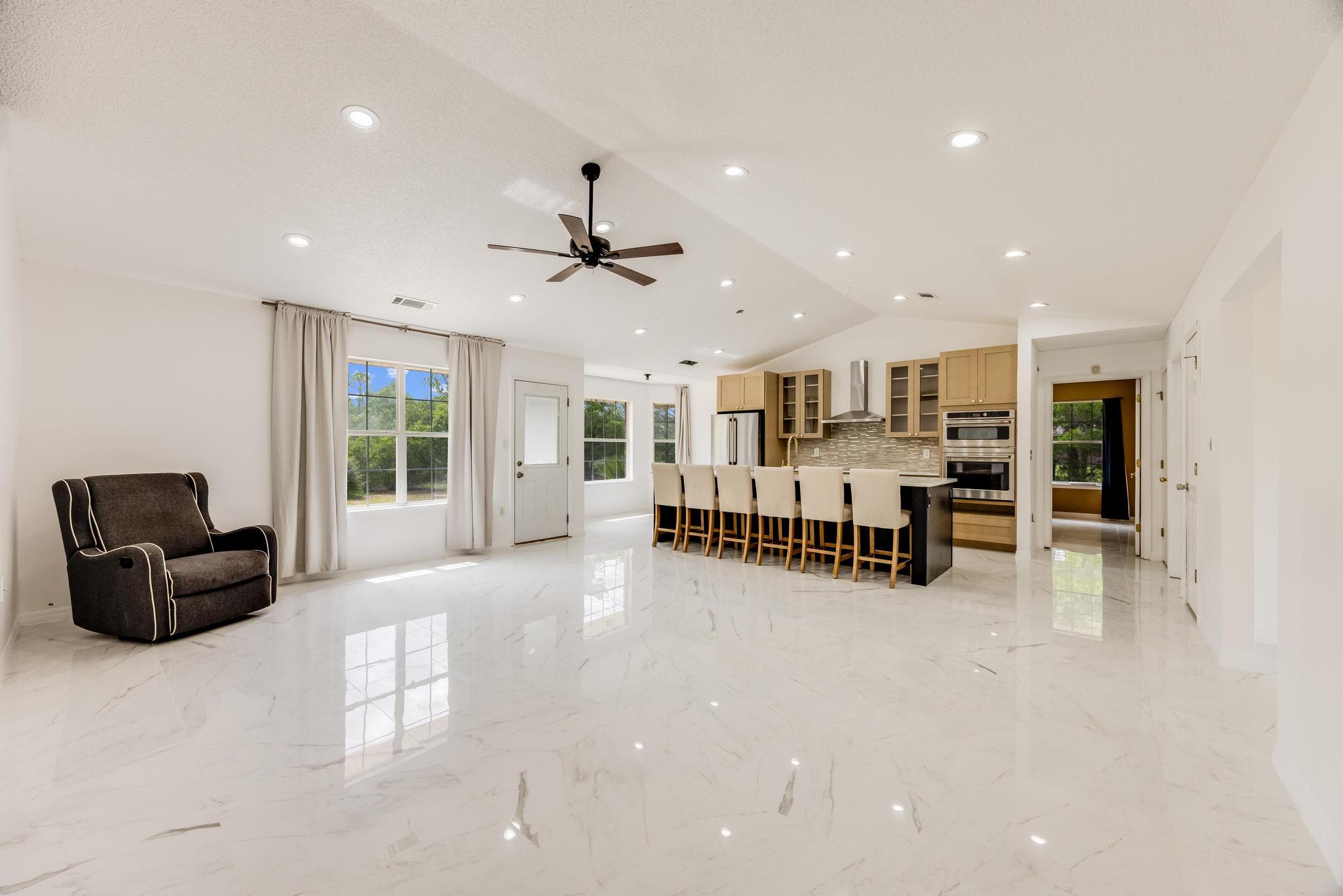 4140 Big Buck Trail Crestview, FL 32539 - Photo 3 of 40 a living room with furniture and a flat screen tv