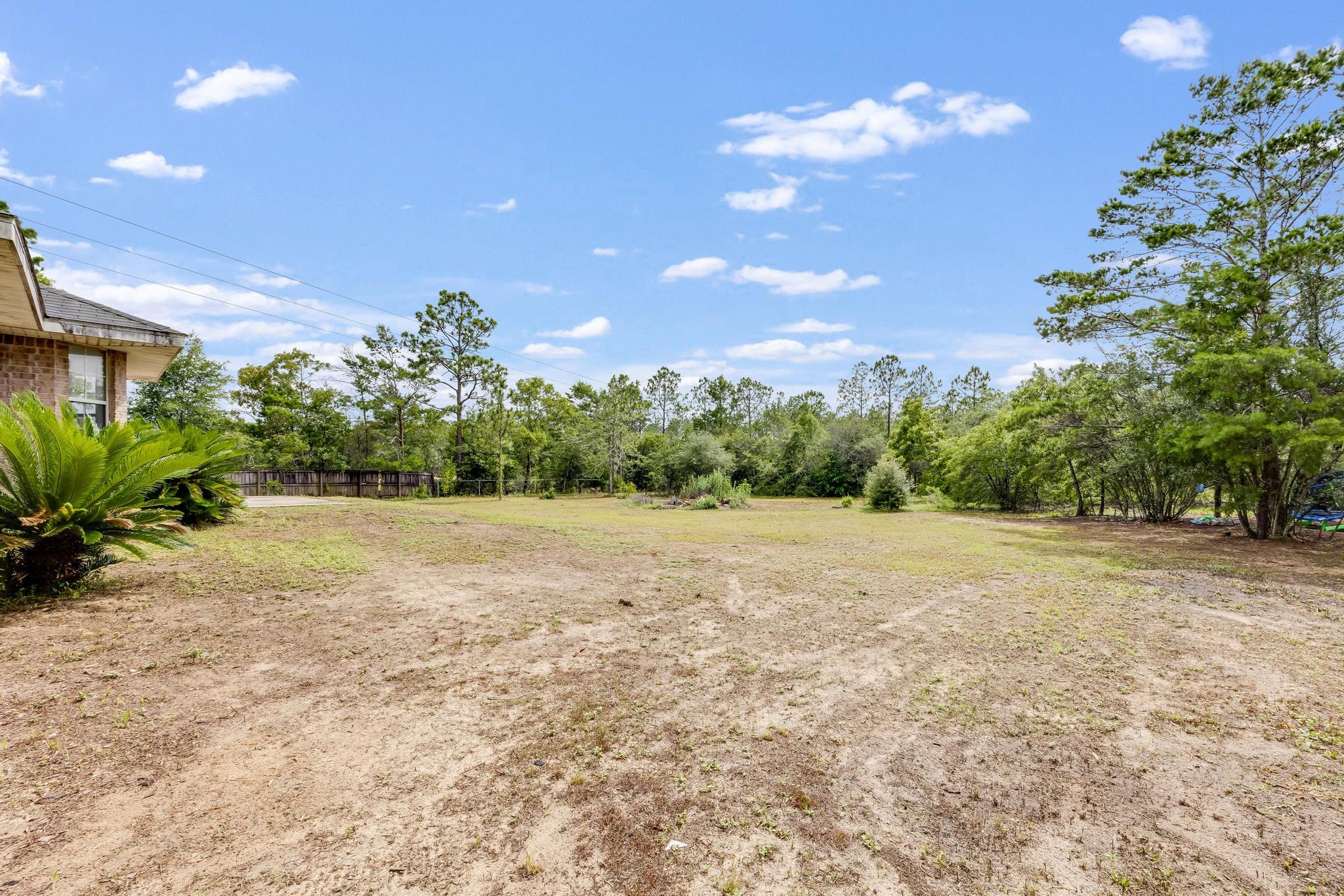 4140 Big Buck Trail Crestview, FL 32539 - Photo 34 of 40 a view of an outdoor space and a yard