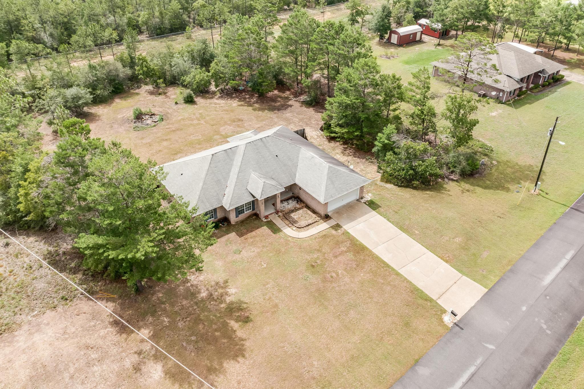 4140 Big Buck Trail Crestview, FL 32539 - Photo 37 of 40 a view of a backyard of a house