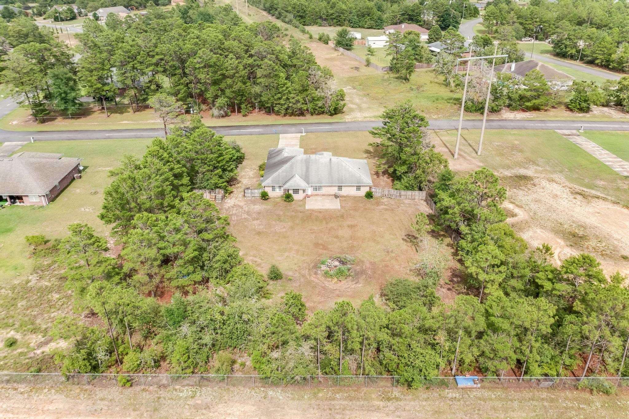 4140 Big Buck Trail Crestview, FL 32539 - Photo 38 of 40 a view of a yard with an outdoor space
