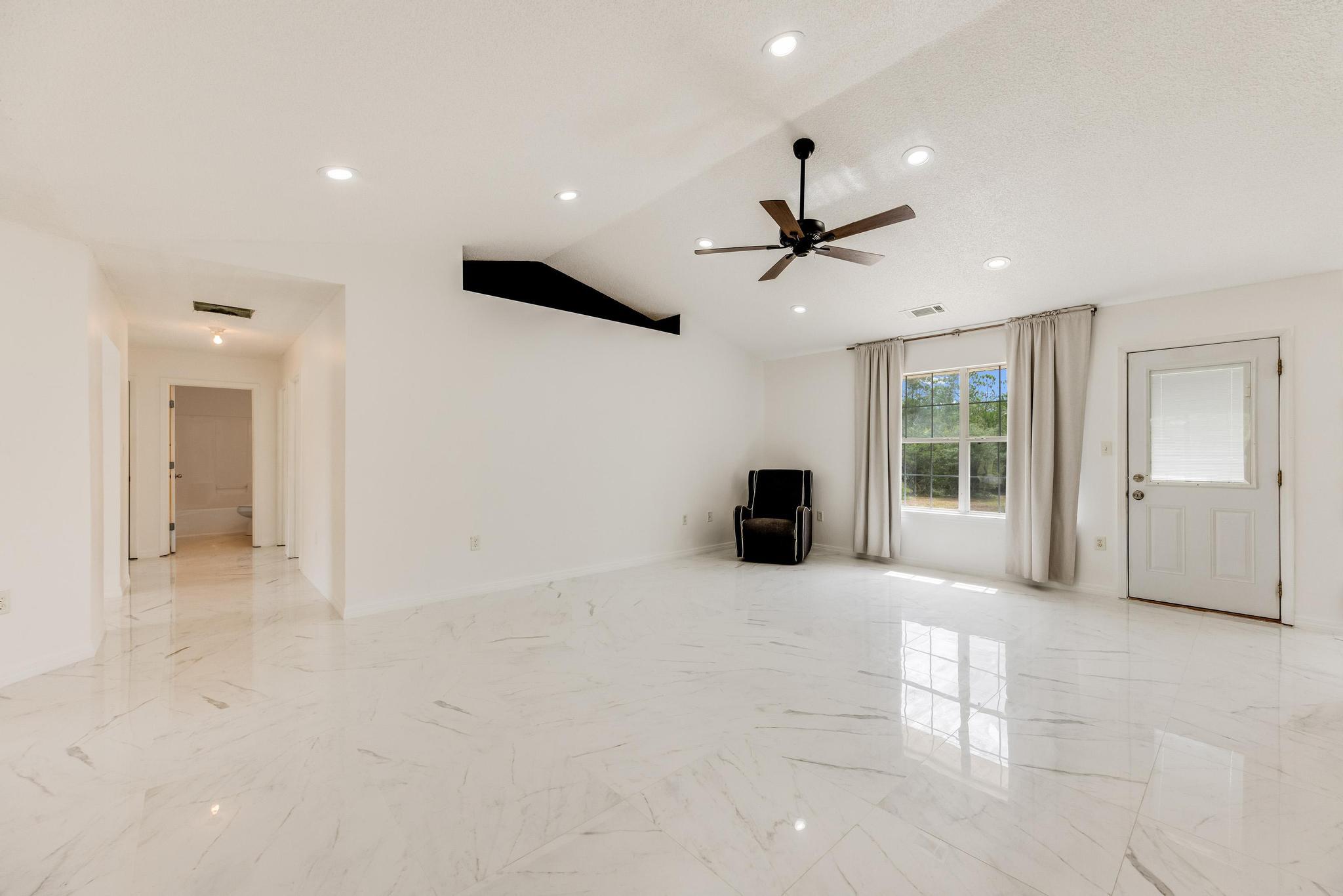 4140 Big Buck Trail Crestview, FL 32539 - Photo 6 of 40 a view of an empty room with a window