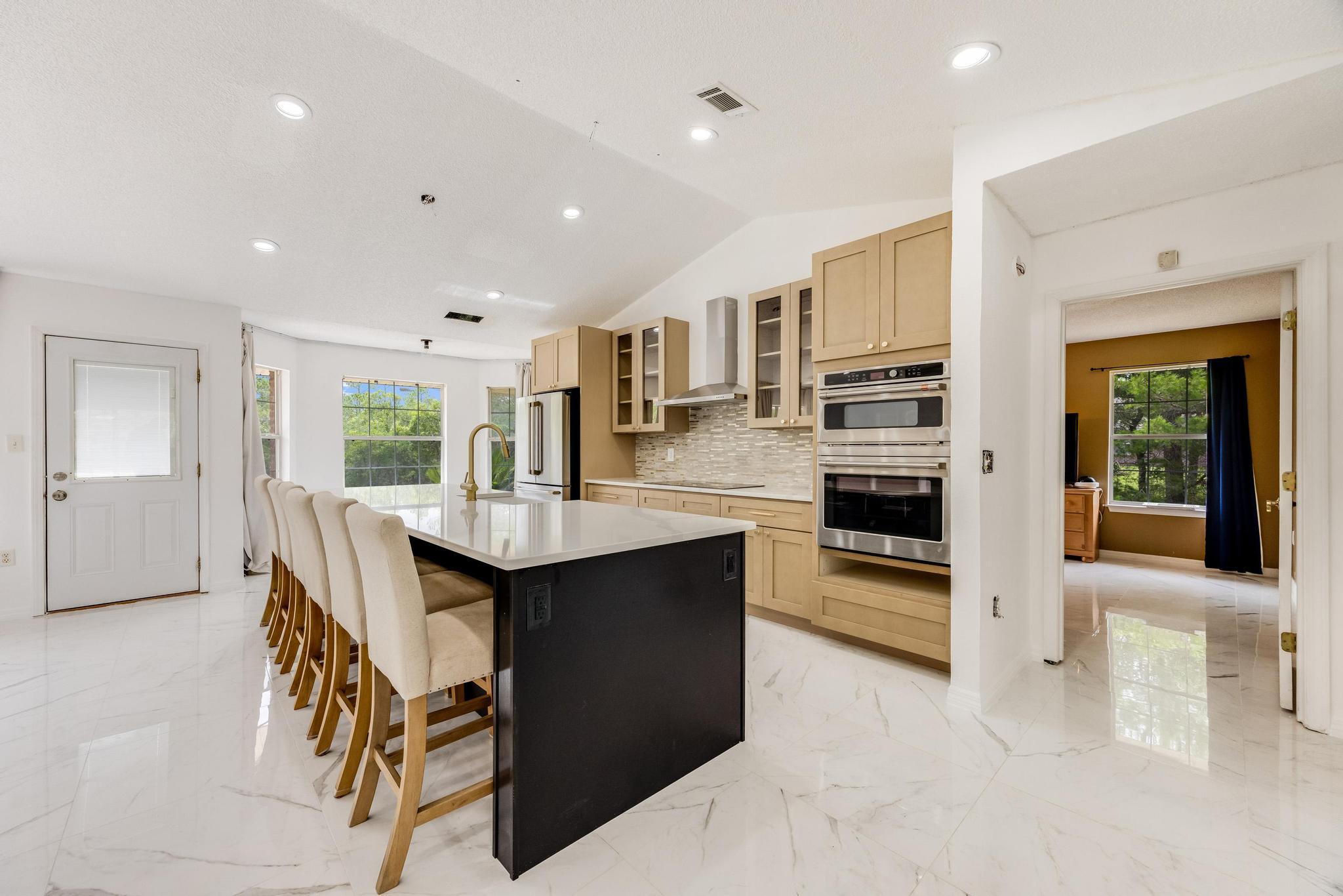 4140 Big Buck Trail Crestview, FL 32539 - Photo 7 of 40 a kitchen with stainless steel appliances granite countertop a stove and a refrigerator