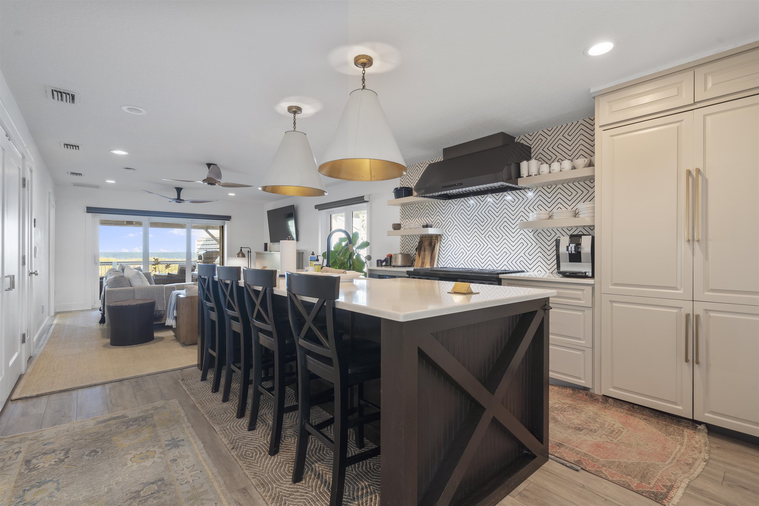 5730 Rudolph Avenue St. Augustine, FL 32080 - Photo 13 of 72 a kitchen with stainless steel appliances granite countertop a sink a stove a refrigerator and island
