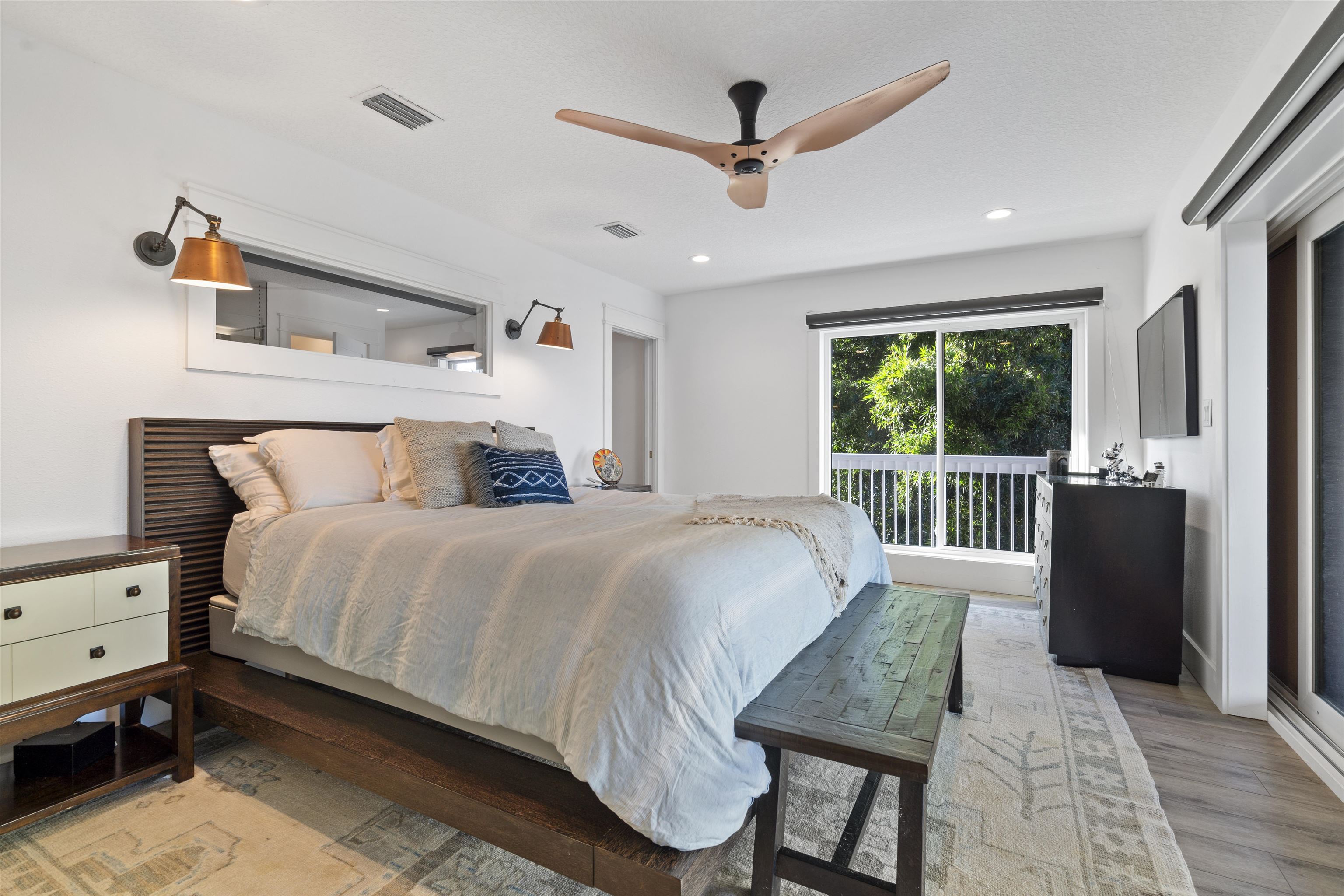 5730 Rudolph Avenue St. Augustine, FL 32080 - Photo 20 of 72 a bedroom with a bed a window and a chandelier