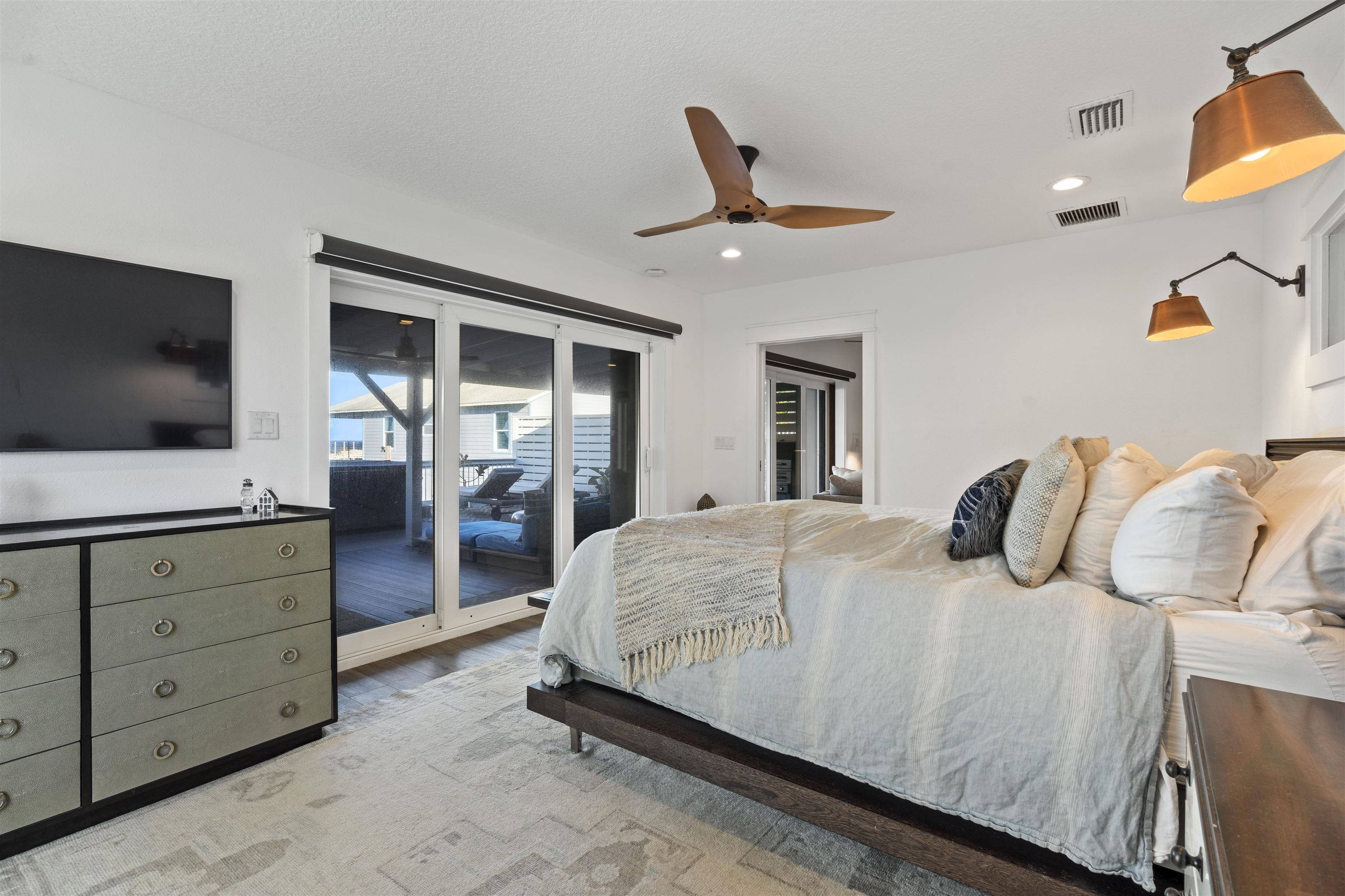 5730 Rudolph Avenue St. Augustine, FL 32080 - Photo 21 of 72 a bedroom with a bed and flat screen tv