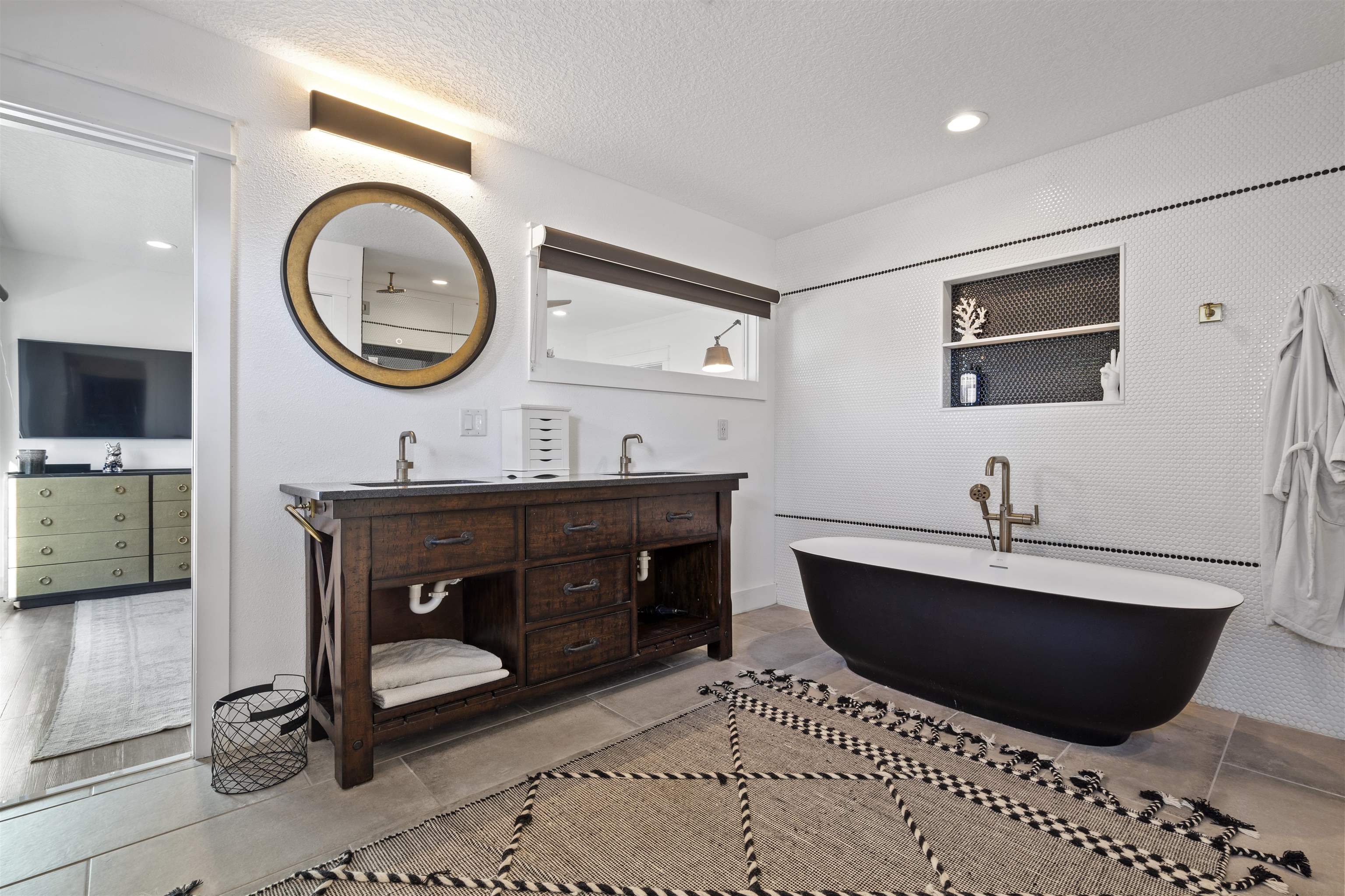 5730 Rudolph Avenue St. Augustine, FL 32080 - Photo 22 of 72 a living room with a couch a mirror and a flat screen tv