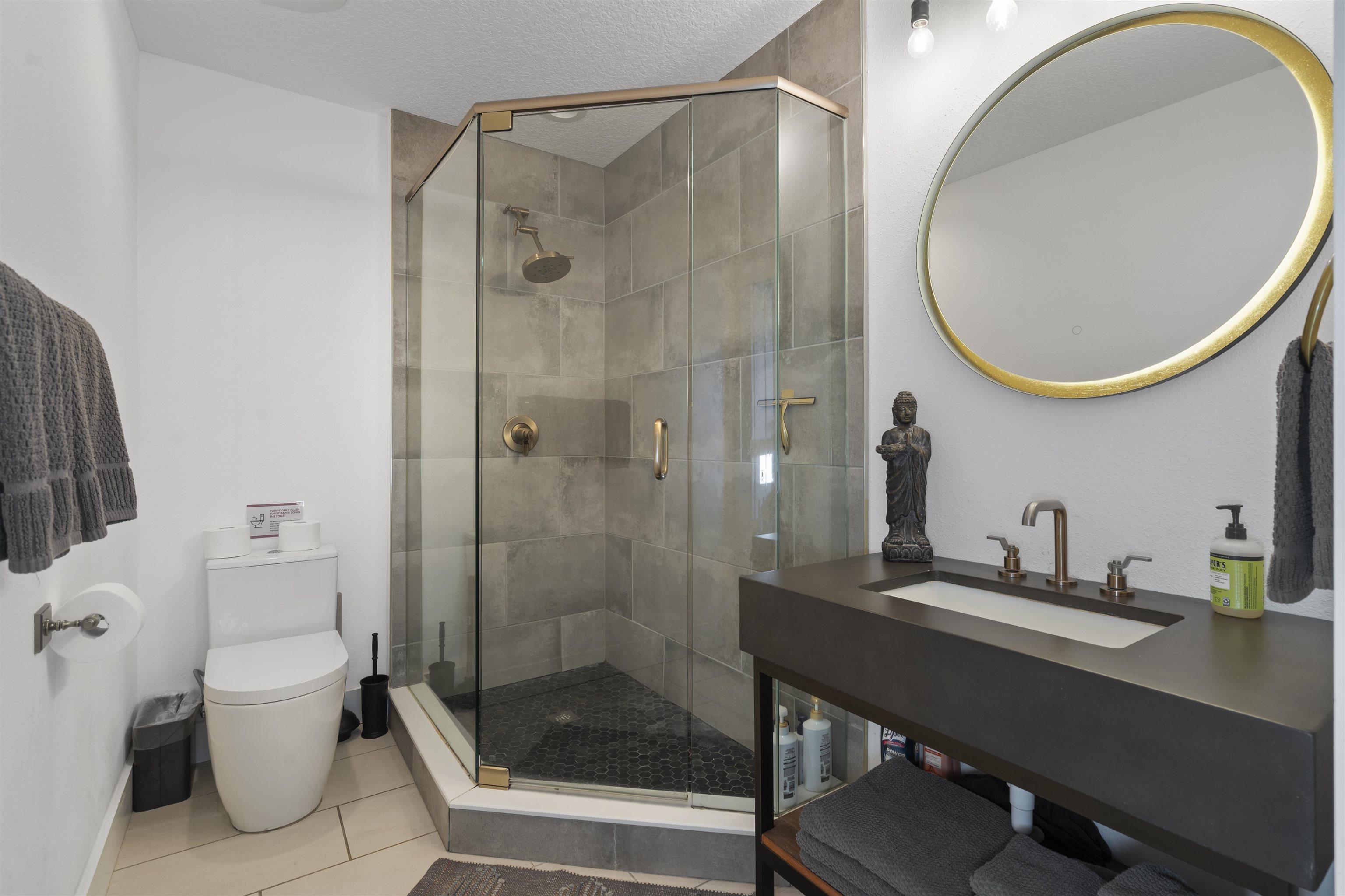 5730 Rudolph Avenue St. Augustine, FL 32080 - Photo 26 of 72 a bathroom with a sink a toilet and a mirror