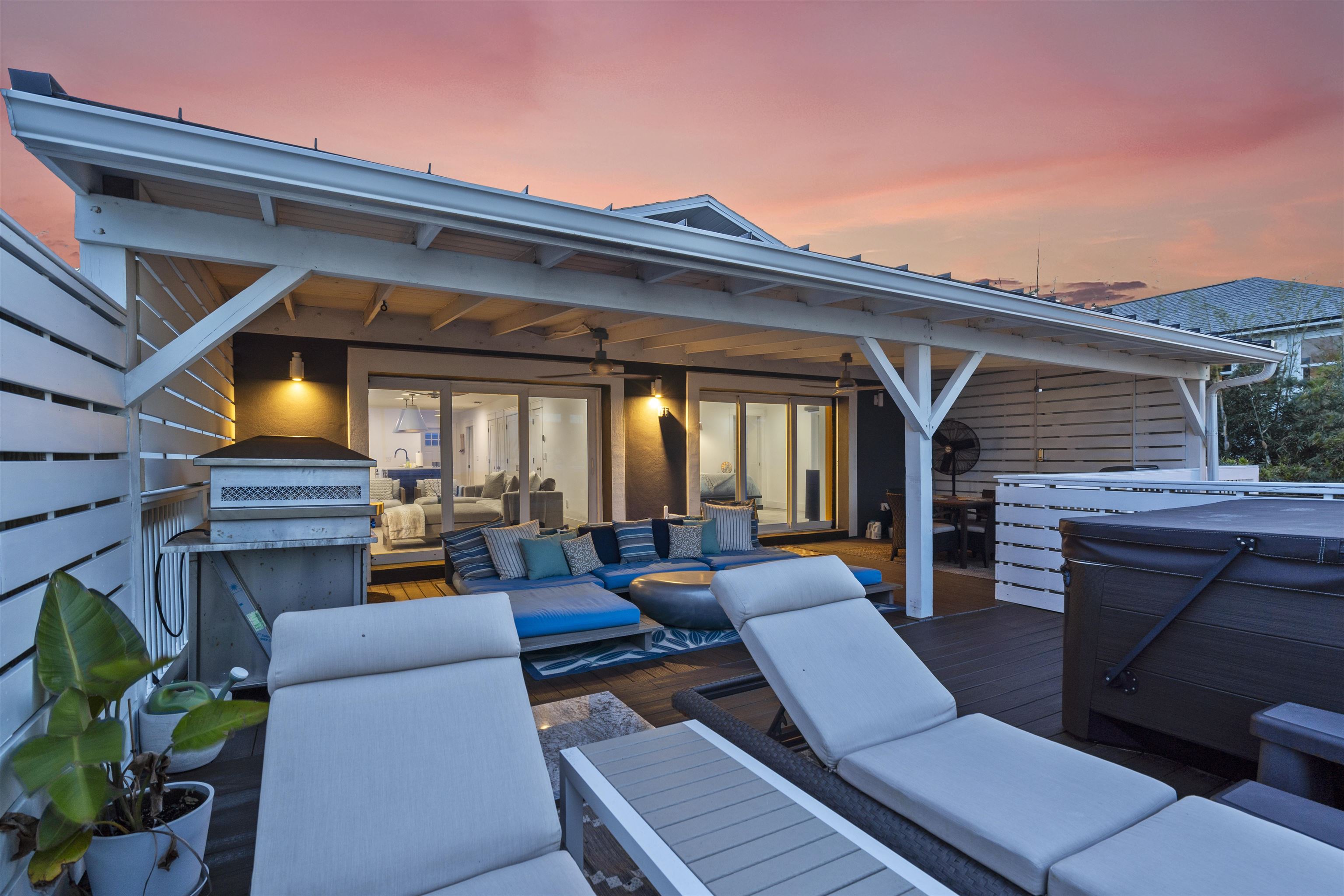 5730 Rudolph Avenue St. Augustine, FL 32080 - Photo 28 of 72 a view of a patio with couches and a table and chairs with wooden floor