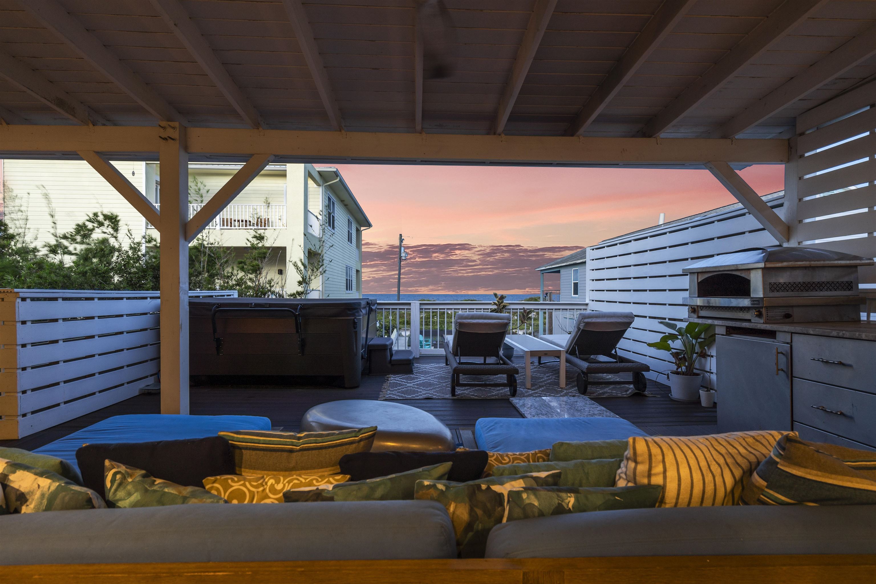 5730 Rudolph Avenue St. Augustine, FL 32080 - Photo 29 of 72 a living room with patio furniture and a fireplace