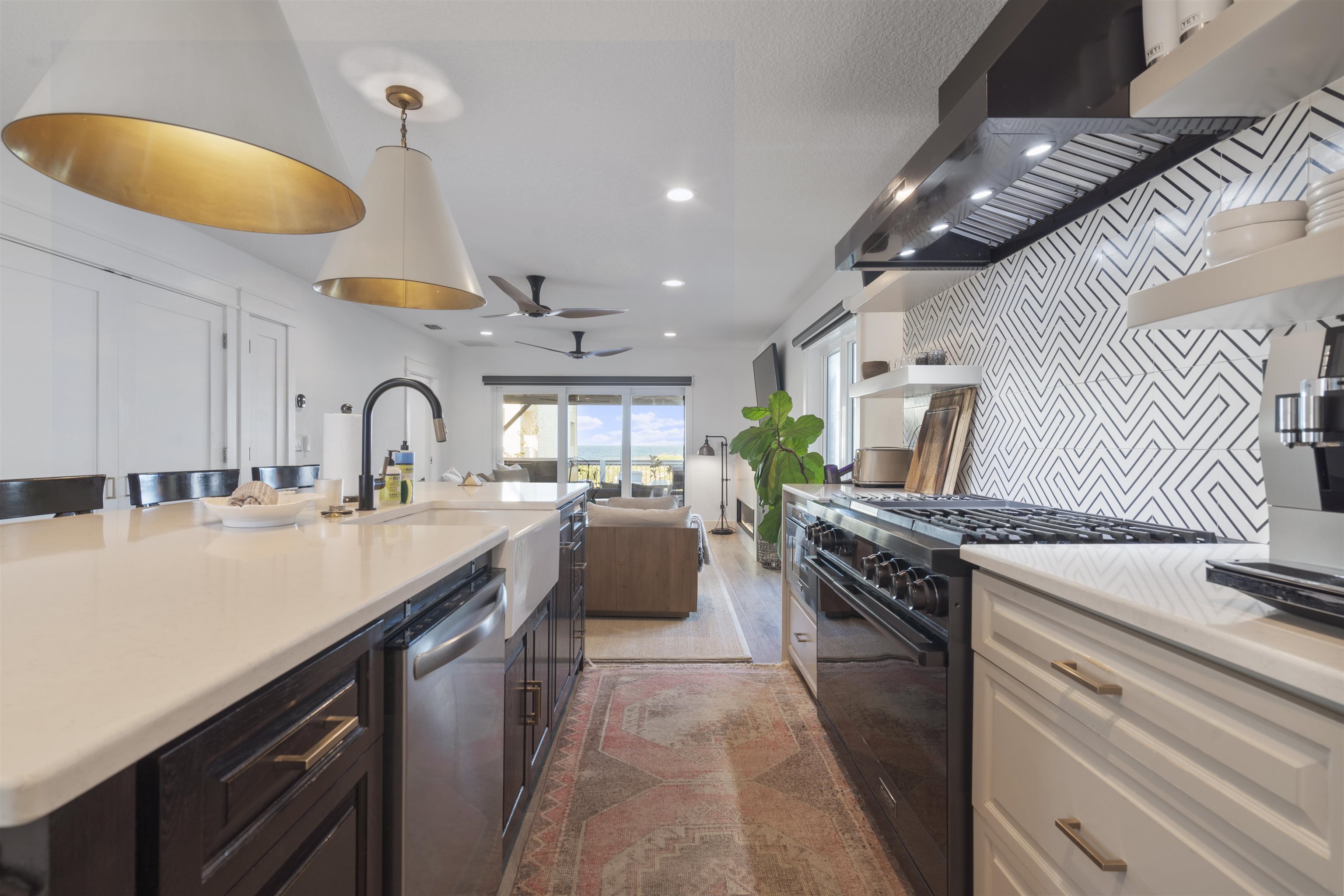 5730 Rudolph Avenue St. Augustine, FL 32080 - Photo 3 of 72 a kitchen with stainless steel appliances a sink a stove top oven a chimney and a center island