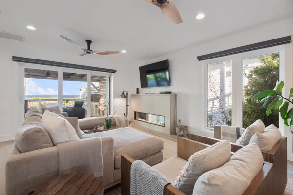 a bedroom with a bed and a flat tv screen on dresser