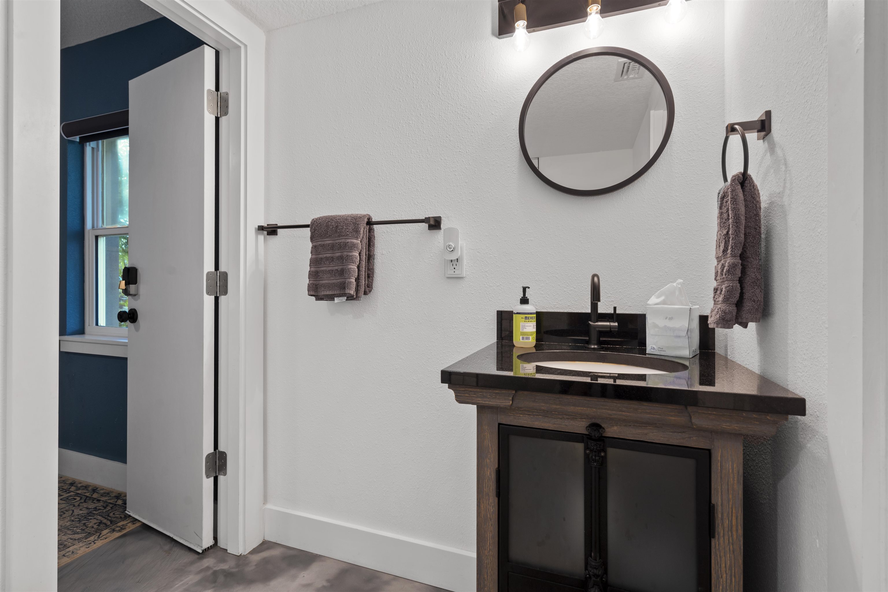 5730 Rudolph Avenue St. Augustine, FL 32080 - Photo 45 of 72 a bathroom with a sink a mirror and a toilet