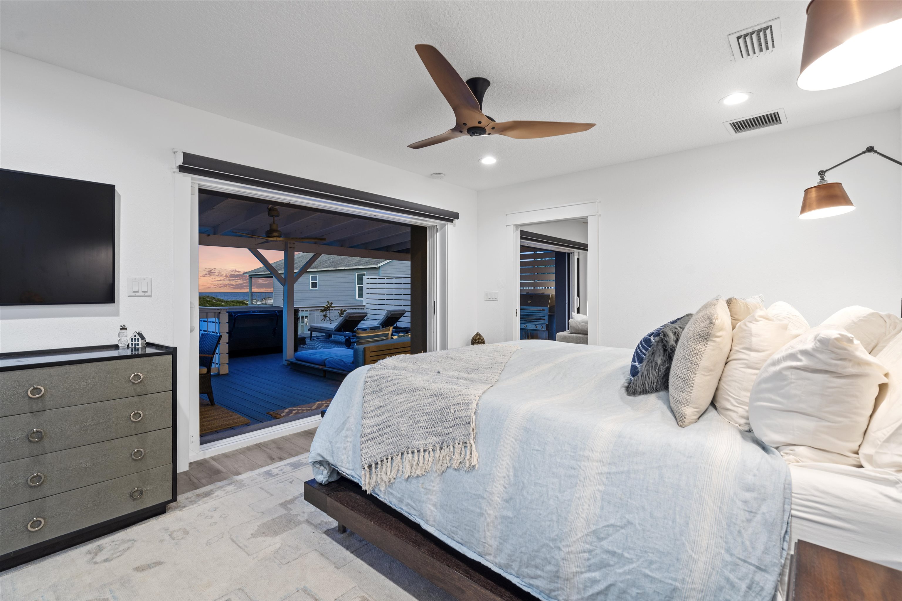 5730 Rudolph Avenue St. Augustine, FL 32080 - Photo 5 of 72 a bedroom with a bed and a flat tv screen on dresser