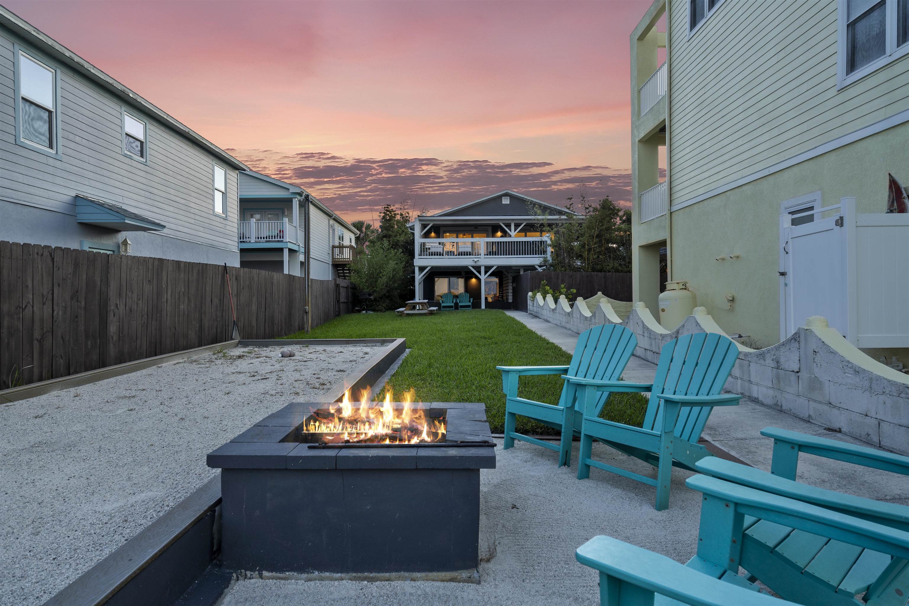 5730 Rudolph Avenue St. Augustine, FL 32080 - Photo 55 of 72 a view of a chairs and table in the back yard of the house