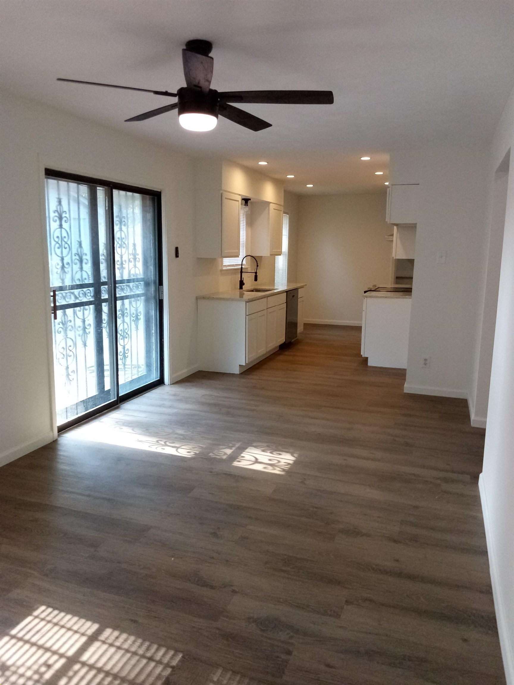 4425 Hodge Road Memphis, TN 38109 - Photo 11 of 37 a view of an empty room with window and wooden floor