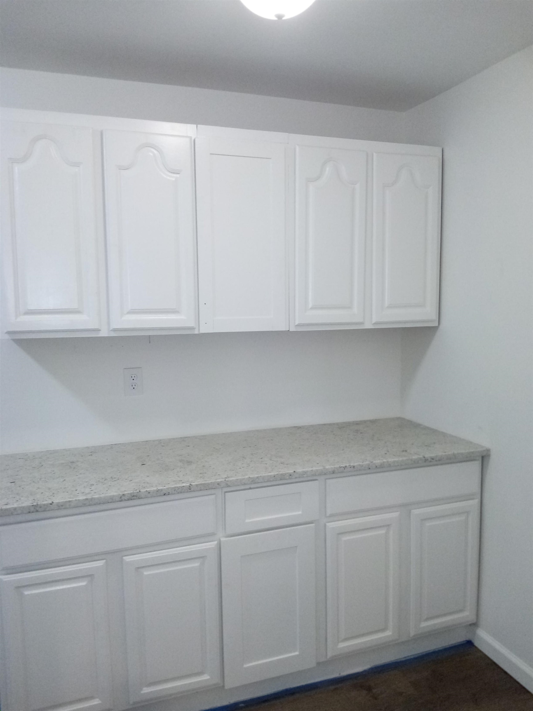 4425 Hodge Road Memphis, TN 38109 - Photo 17 of 37 a kitchen with white cabinets