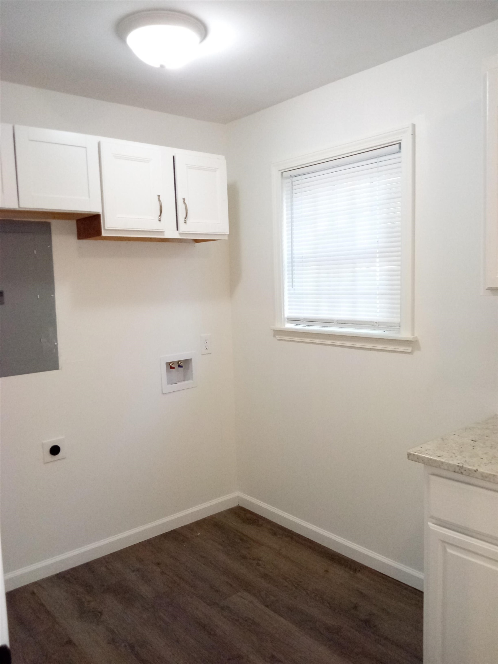 4425 Hodge Road Memphis, TN 38109 - Photo 19 of 37 a view of a kitchen with wooden floor and cabinets
