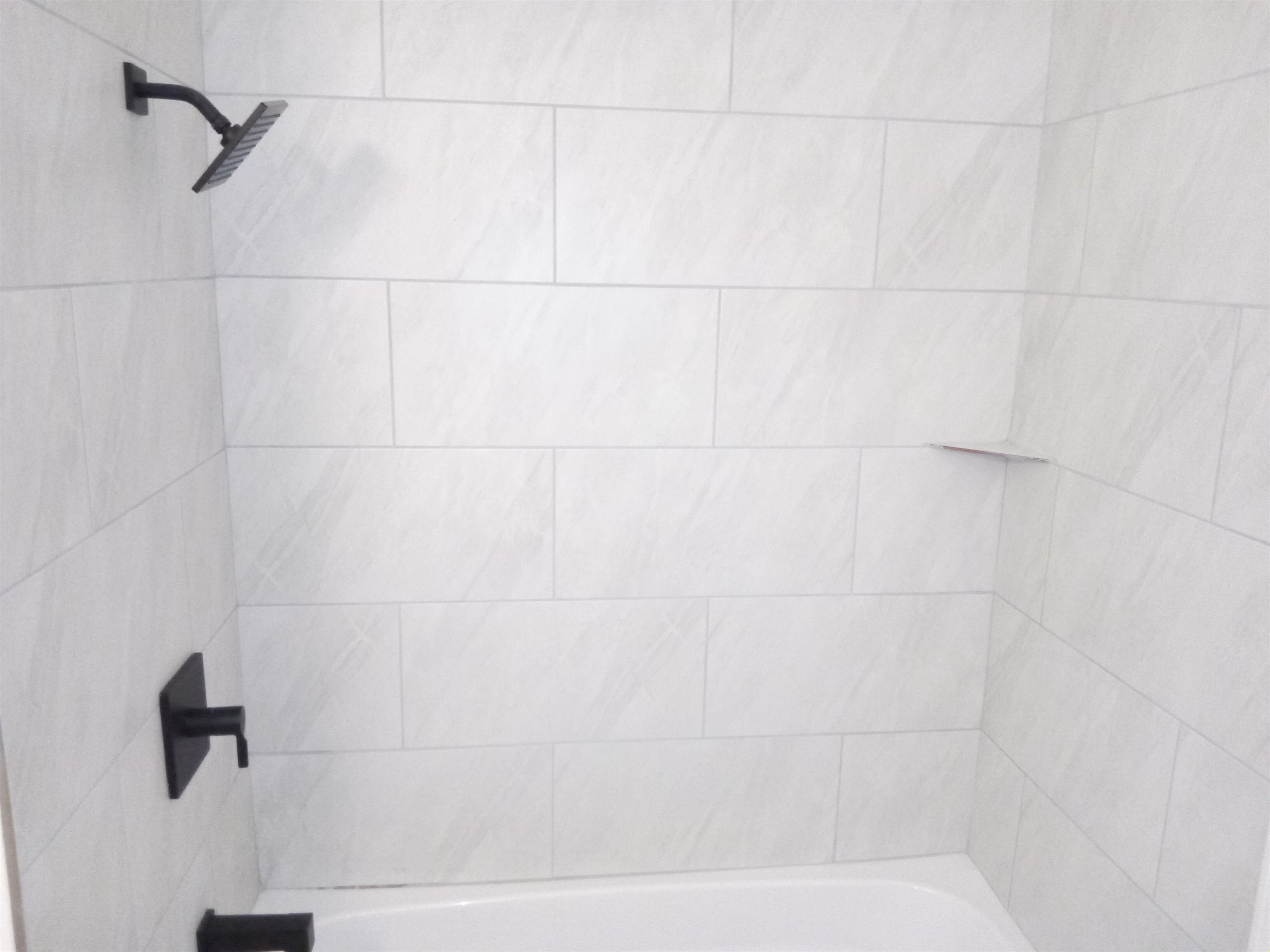 4425 Hodge Road Memphis, TN 38109 - Photo 24 of 37 a bathroom with a shower