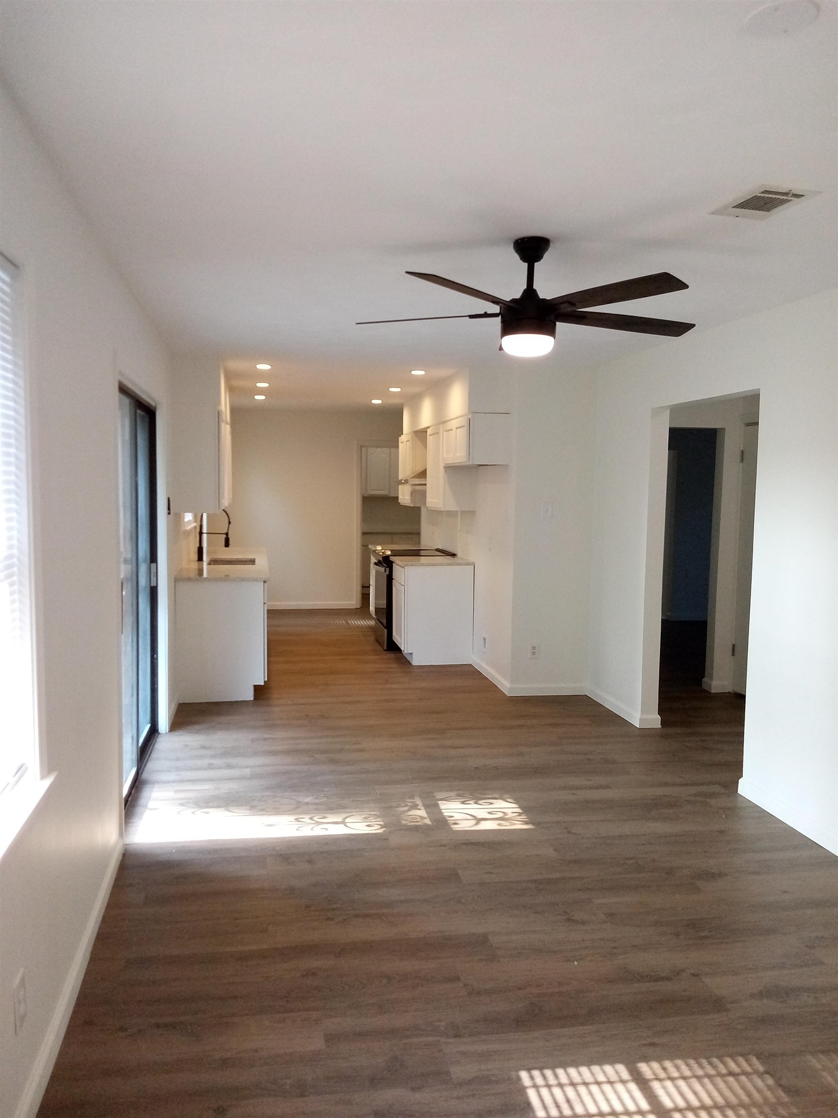 4425 Hodge Road Memphis, TN 38109 - Photo 10 of 37 a view of a kitchen with a sink and a kitchen view