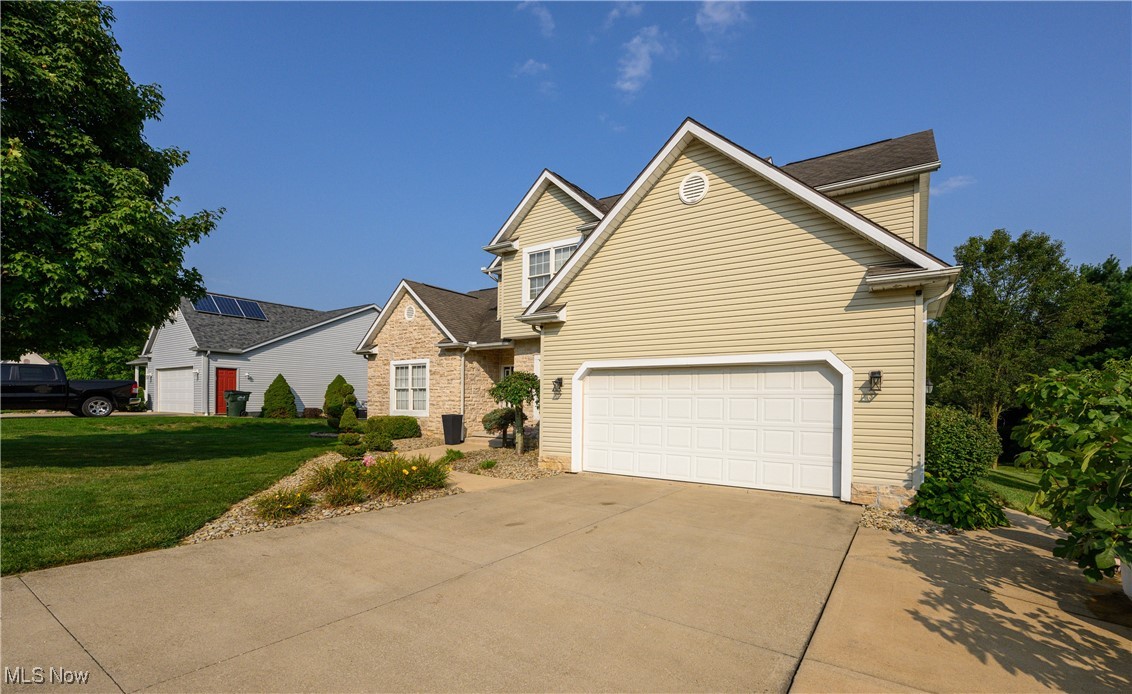 6986 Sweetwater Road Northeast Canton, OH 44721 - Photo 31 of 36 Another view of Front of home with 2-car garage and extra parking pad