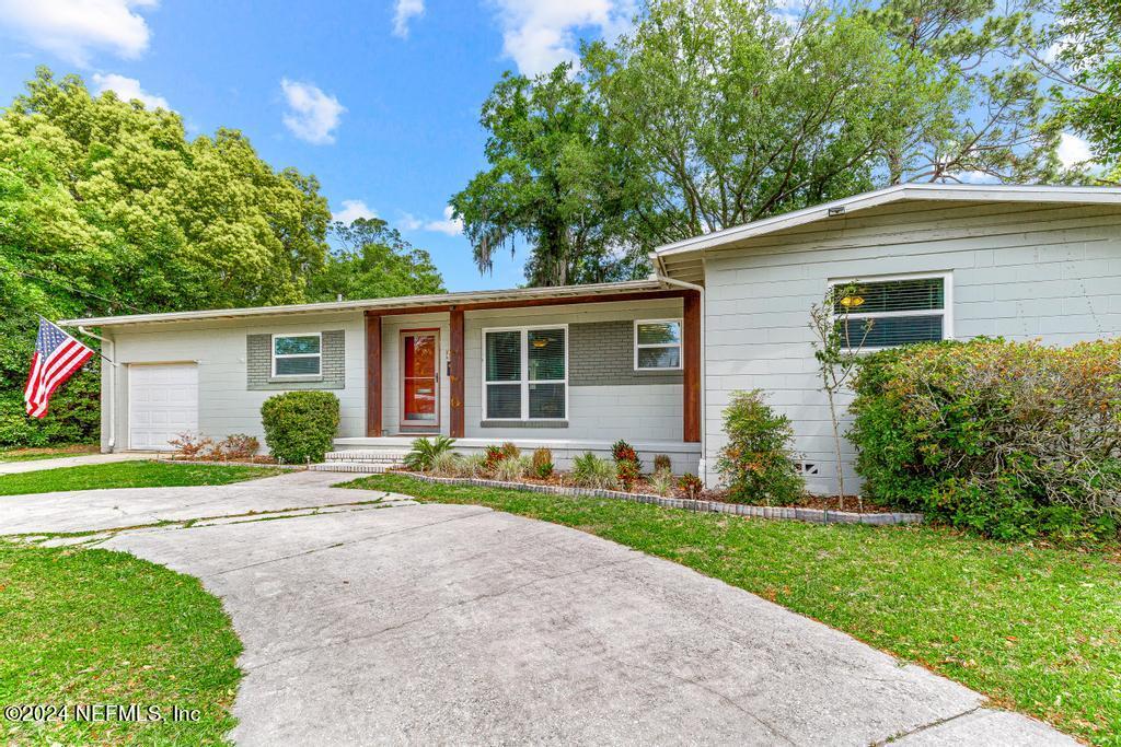 front view of a house with a yard