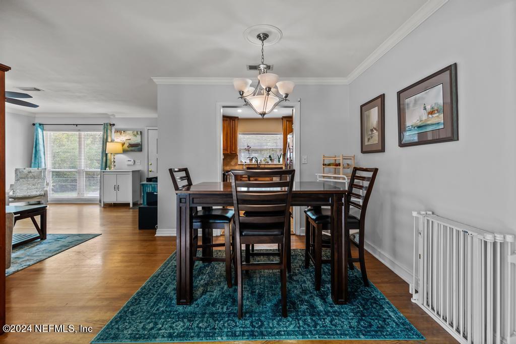 3645 Marianna Road Jacksonville, FL 32217 - Photo 14 of 44 a view of a dining room with furniture window and wooden floor